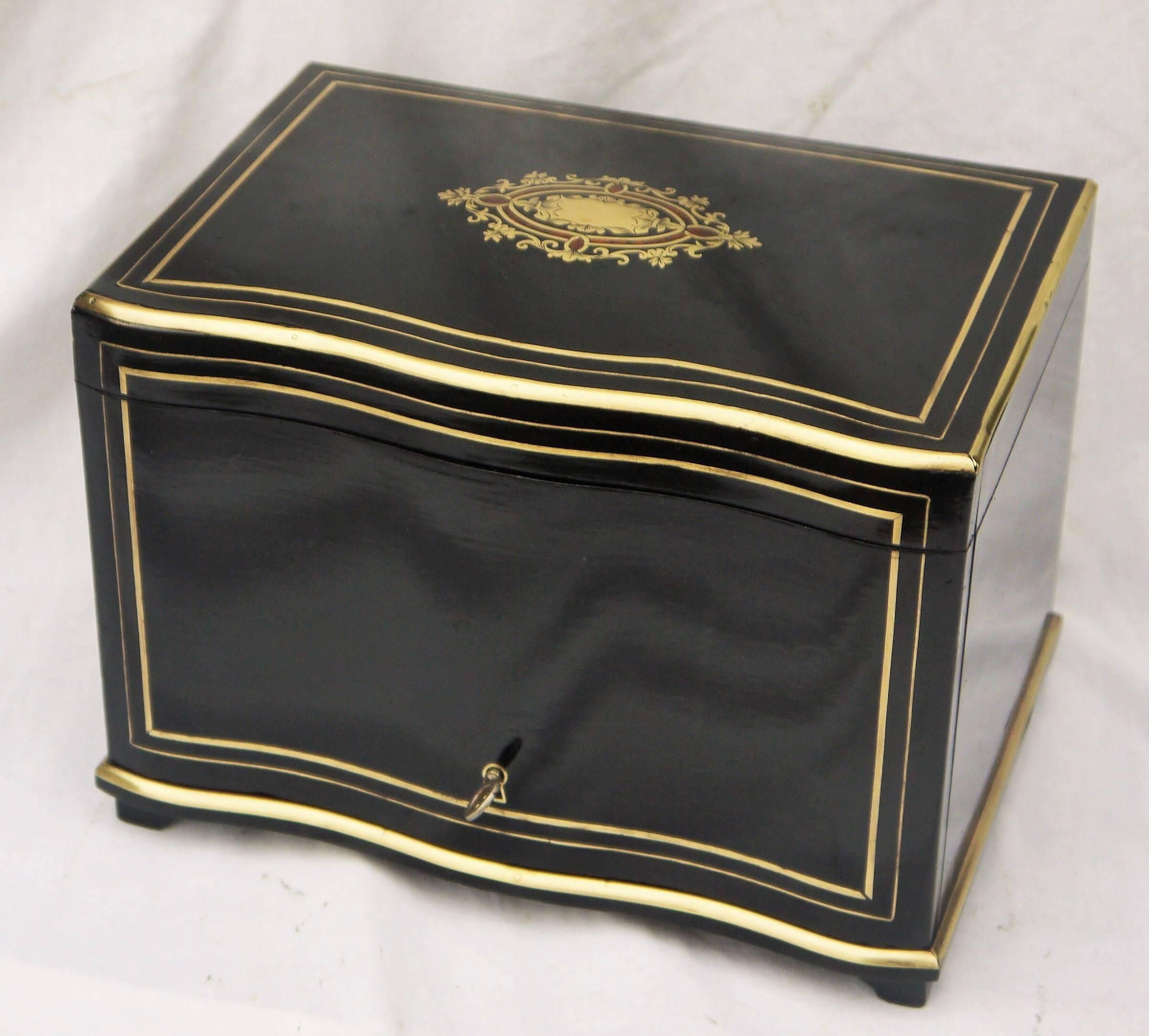 Very elegant Napoleon III style cigar box cave, in boulle brass marquetry and brass and mahogany cartridge.

Beautiful shape, decorated with Polished Bronze. Inside of it you find four shelves, plates of cigars and one drawer at the bottom