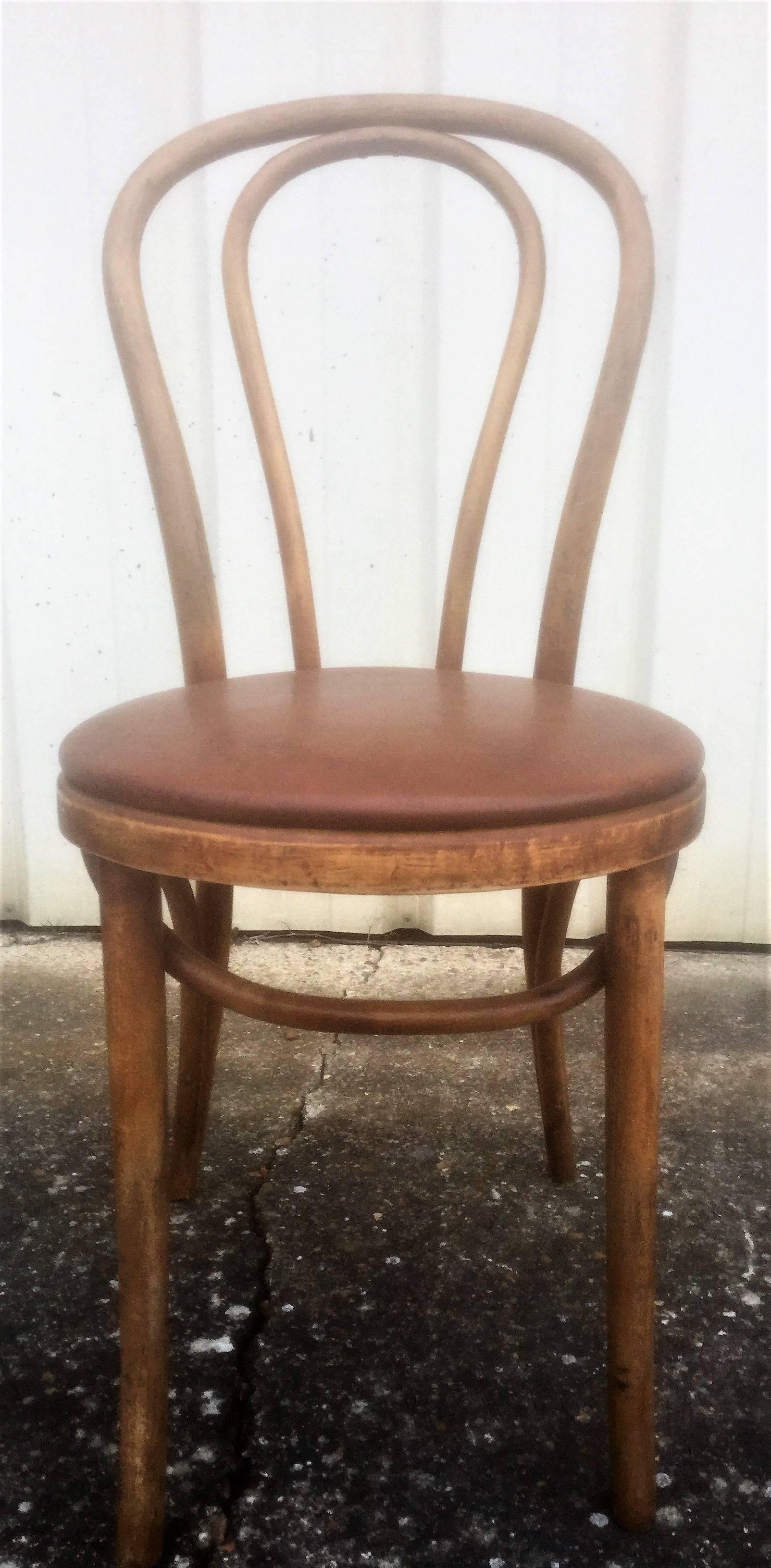 Set of twelve Thonet bentwood beech chairs in brown faux leather in good condition, 

circa 1950.