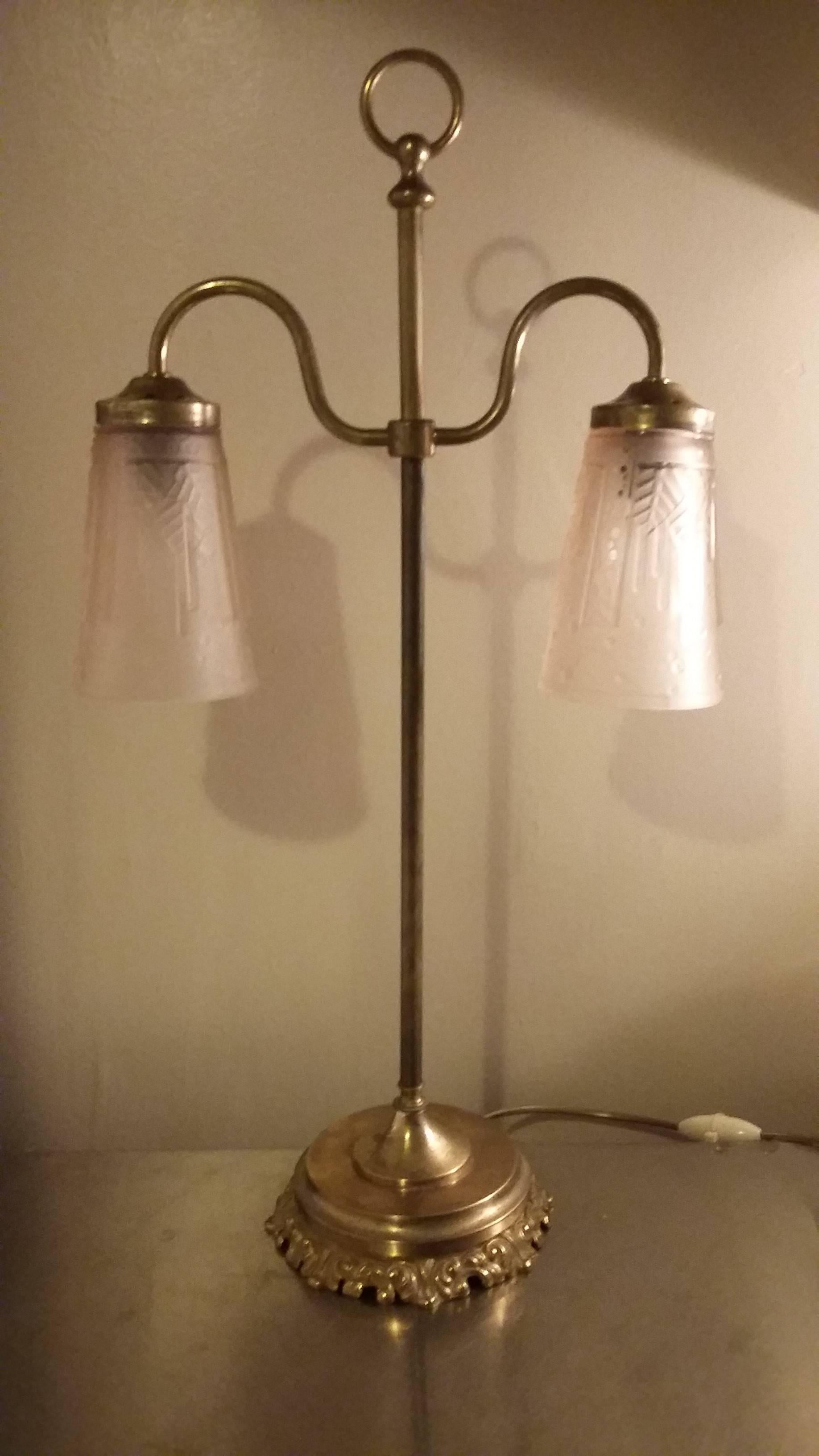 French tall double two arms table lamp in a bronze and brass base foot and two tulip style lampshades in cast pressed glass in light pale rose color.

Signed by Muller Frères Luneville, circa 1920

Very good condition, the electric part has been