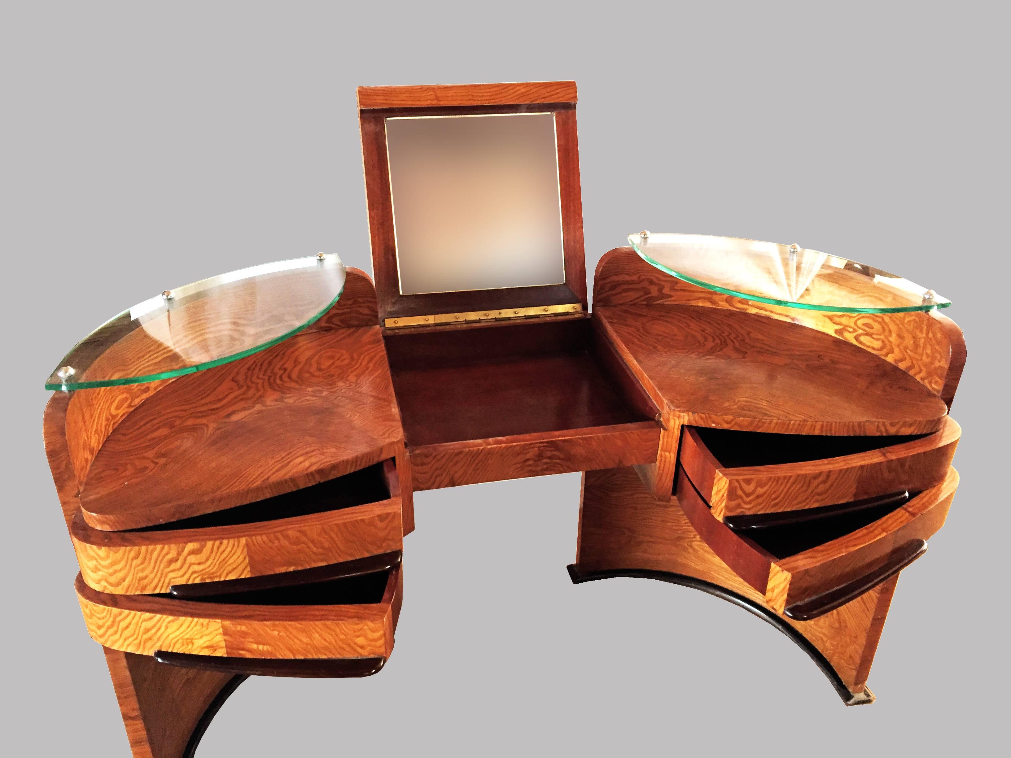 Gorgeous and unique Art Deco Coiffeuse Vanity Dressing Table in Ramageux elmwood in beautiful shellac varnish and with glass shelves, four storage drawers and a flip up mirror. Even the back part is beautiful and in a excellent condition and it can