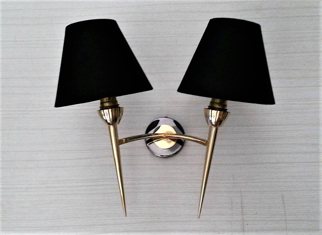 Beautiful set of three 2 arms bronze sconces, France, 1950s by Lunel.
In an ex excellent condition. Each double sconce has a different complimentary patina to match the other: one is in a metal gun patina, the other a golden patina, and the last one