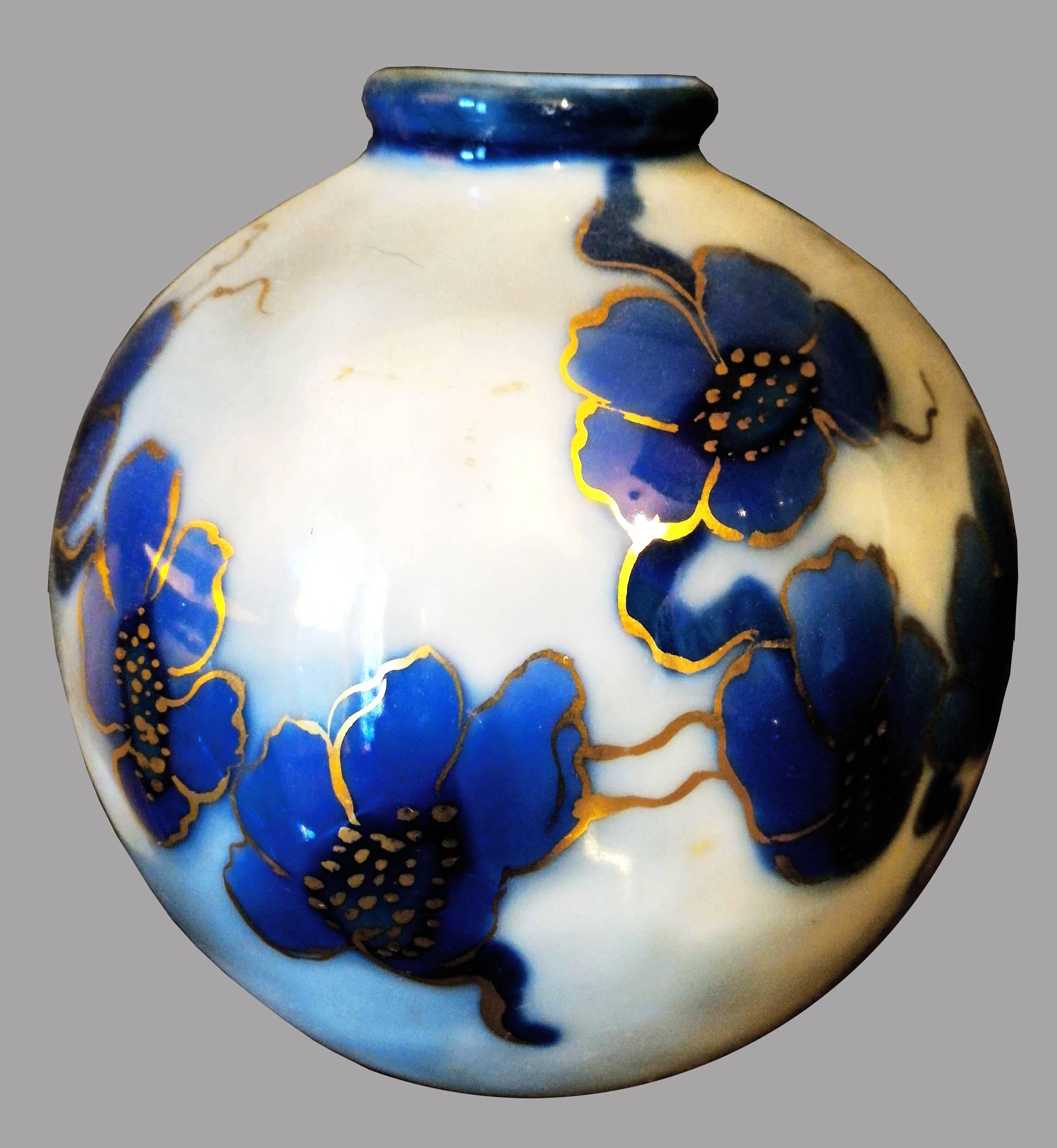 Charming 20th century Camille Tharaud ball vase in Limoges porcelain
Beautifully decorated with a blue flower garland enhanced with a gold filet.

Camille Tharaud born in France in 1878 was probably the most important artist ever for making