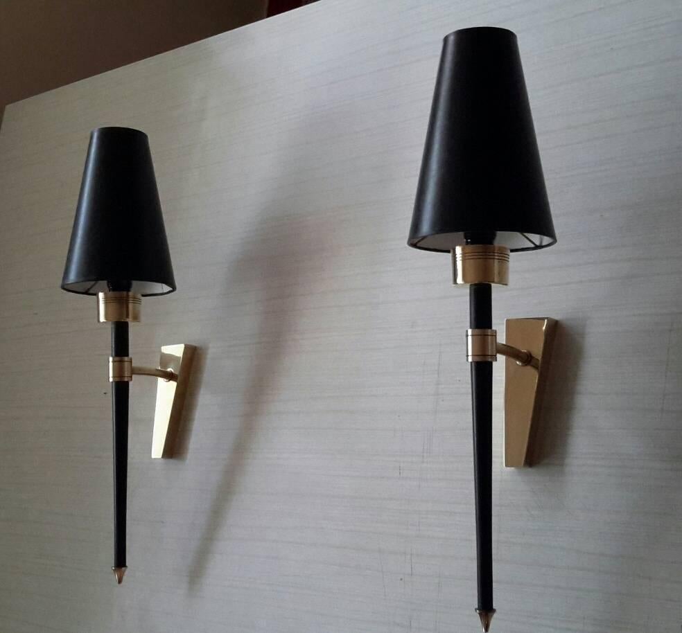 Gorgeous and big size pair of Mid-Century Modern sconces by Lunel, France, 1950s.
In black matte lacquered and brass.
Electric part fits US standards (Maxi 40 watts each)
Dimensions: 
Total height 48 cm
W: 12 cm
D: 16 cm
Height up to the lamp