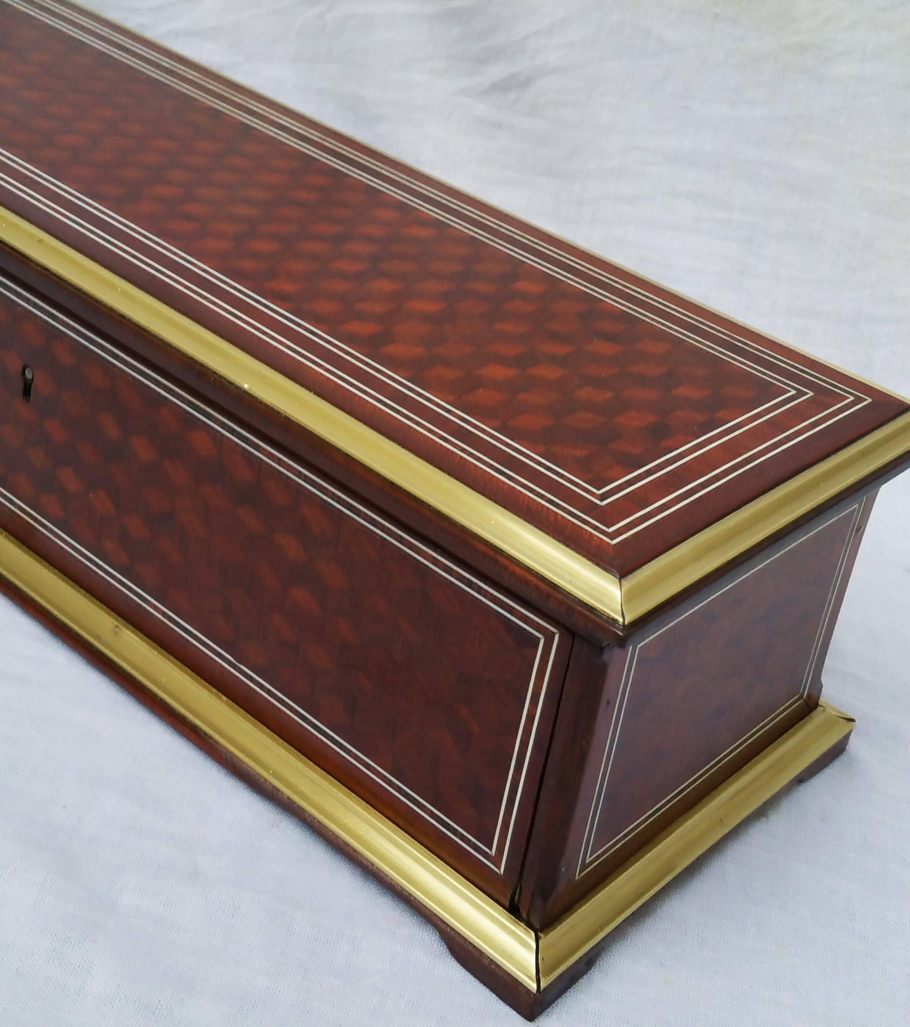 Big size elegant jewelry decorative box that used to be a gloves box. All sides are beautifully checkerboard style wood veneered decorated with precious woodq and mahogany, brass, bones and polished bronze and horn marquetry.
The inside part is