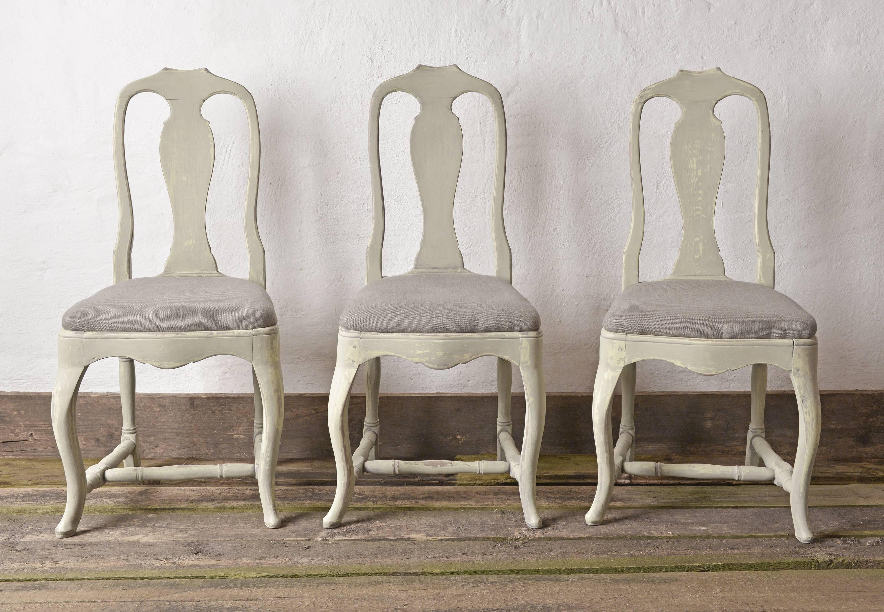 A well preserved set of three Swedish Provincial, circa 1770 dining or side chairs of elegant soft lines in a retouched green-grey paint.
Upholstered in a green-grey linen.