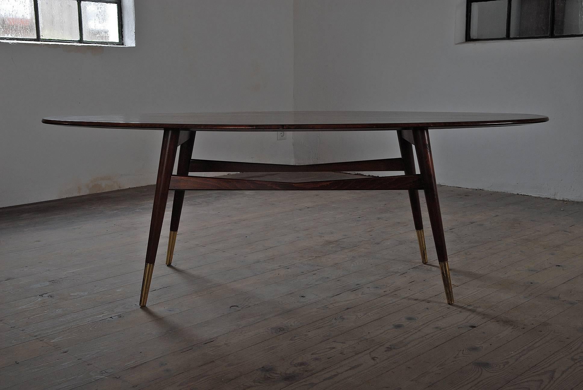 A very stylish Danish midcentury coffee table with brass sabots and a beautiful veneer.