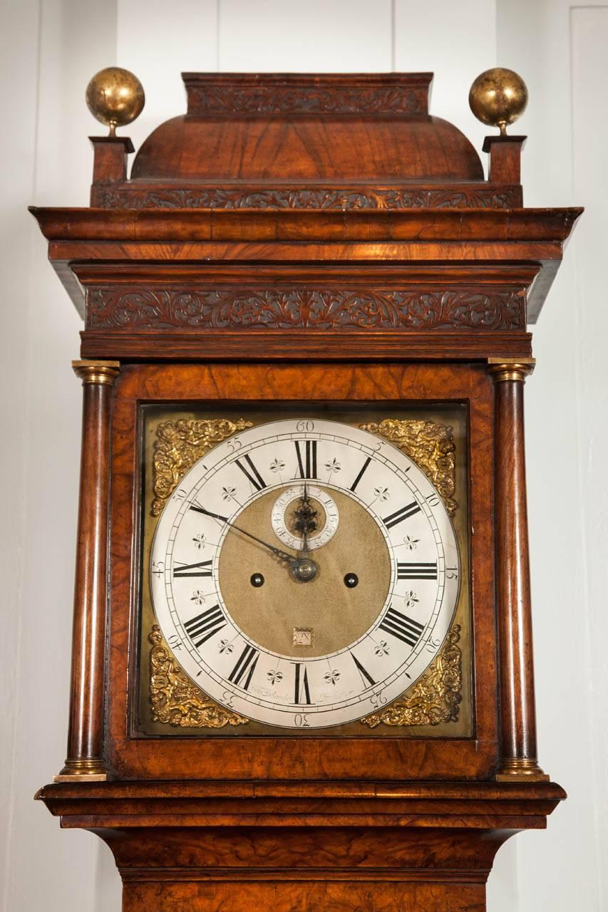 A fine Queen Anne period figured walnut longcase clock with square shaped dial and caddy top by this famous apprentice of Thomas Tompion. 

The case is veneered with figured walnut of excellent color and patination. The pull-forward caddy top hood