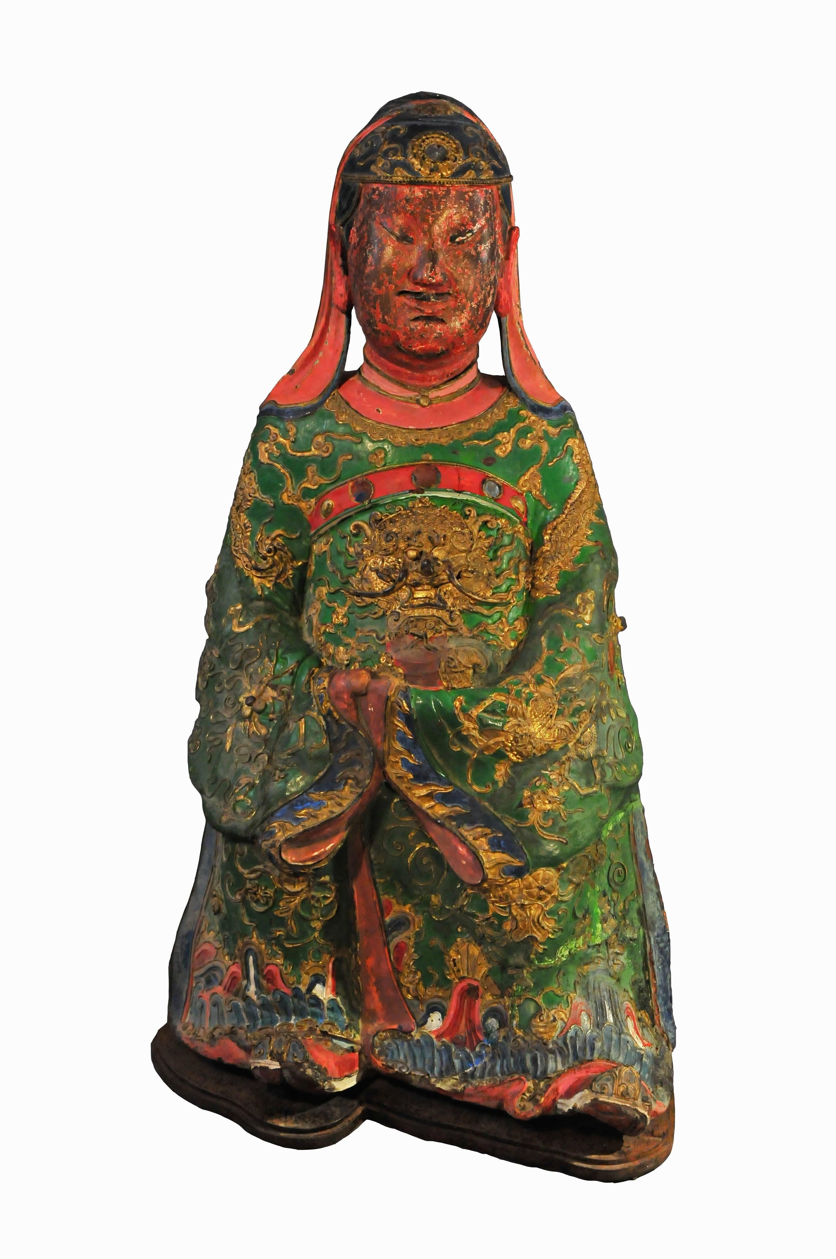 This statue is the representation of Guan Yu or Guan Gong, a god of the Chinese popular pantheon. Guan Yu was a famous warrior serving under the emperor of Shu Kingdom, Lei Bei, in the Three Kingdoms era. It is one of the most dramatic periods in