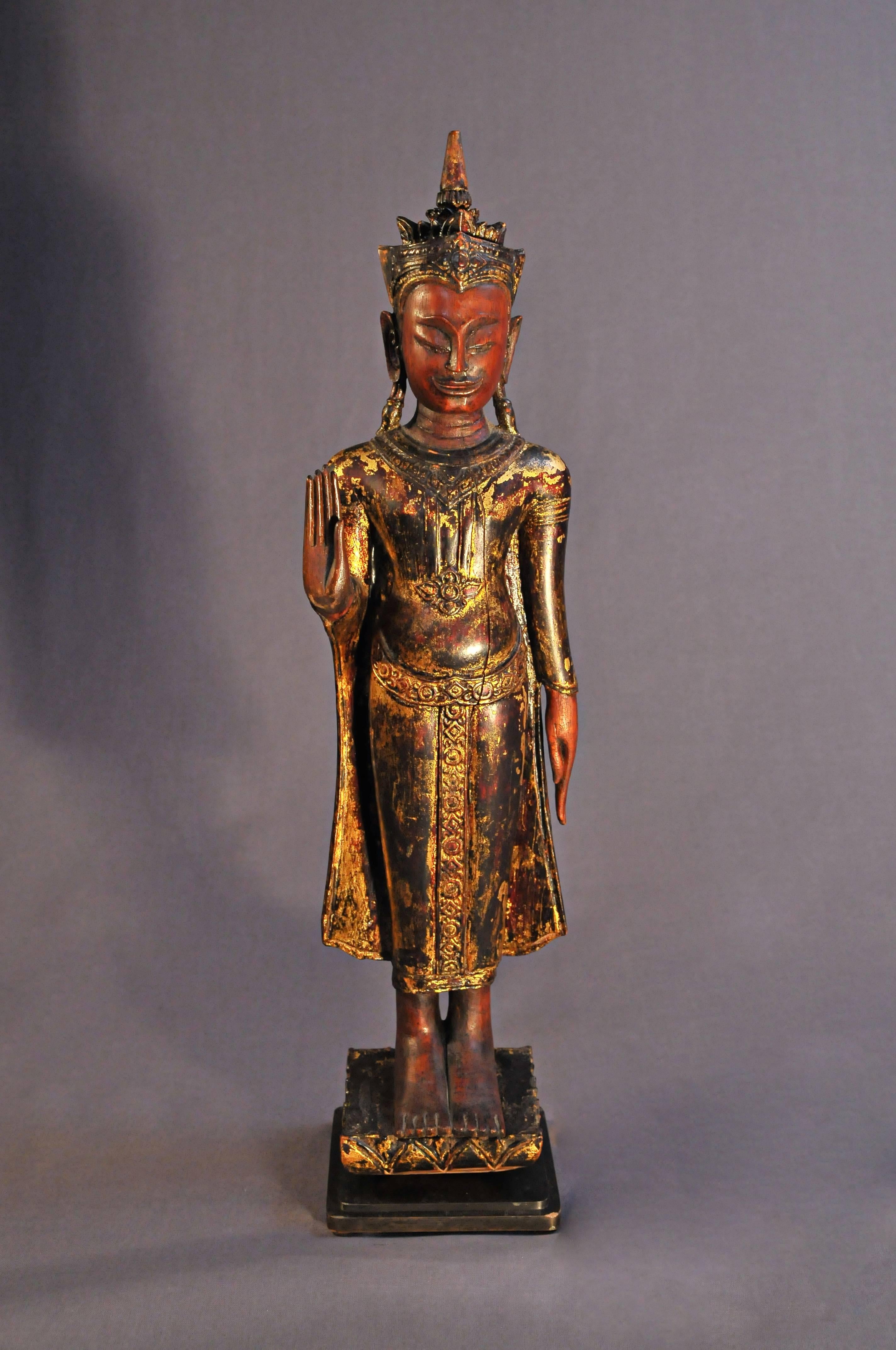 The founding of the kingdom of Ayuthaya by the Prince of U Thong in 1350 also marks the birth of a unified Thailand.

This Buddha wears a monastic robe revealing the undergarment belt which vertically folds between the legs. Heavy earrings