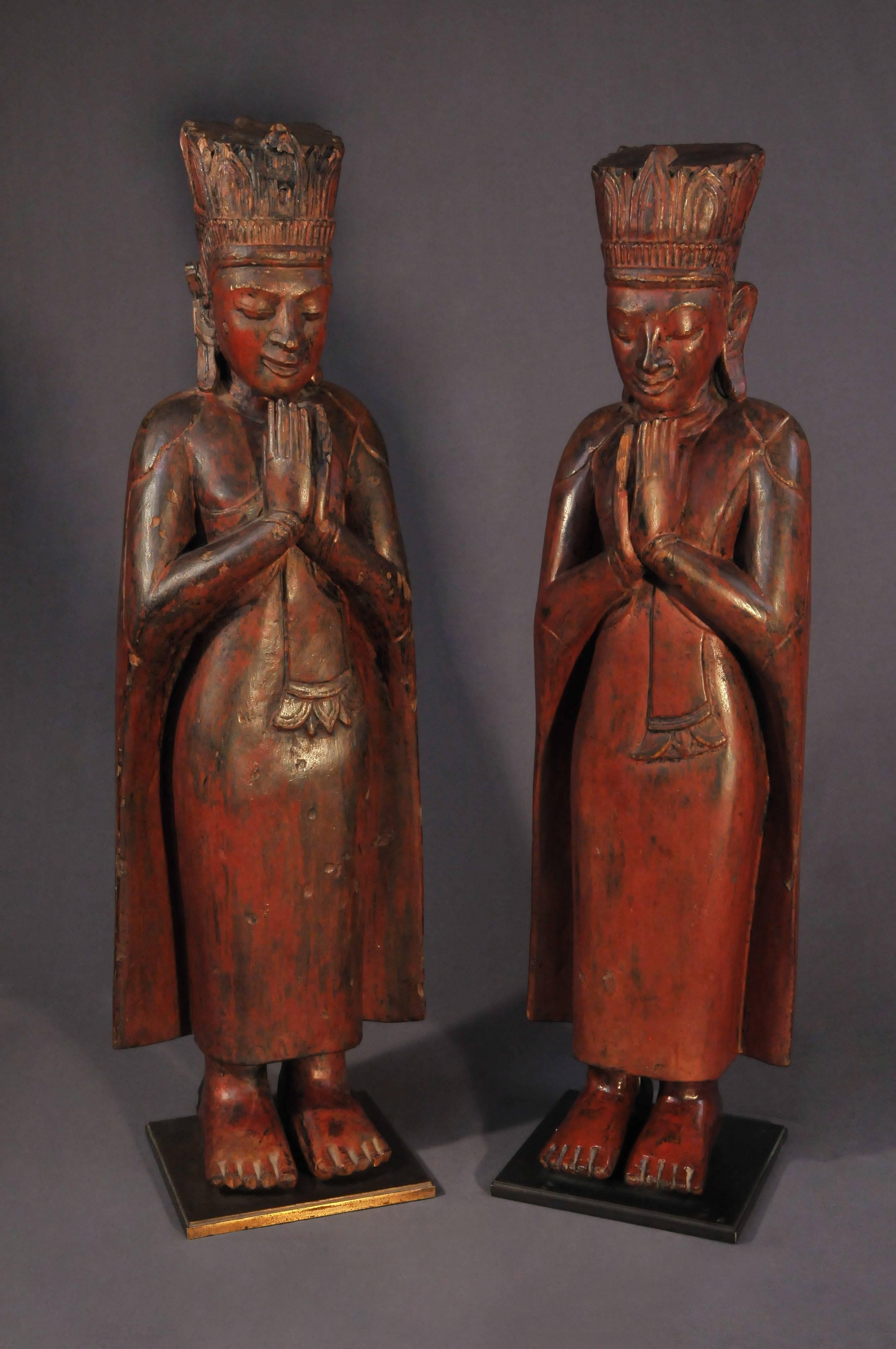 In addition to Buddha images, Myanmar sculptures feature human figures in real form, such as monks. This pair of standing monks close their eyes, place their head downward, press their palms together in a gesture of praying called Anjali Mudra. With