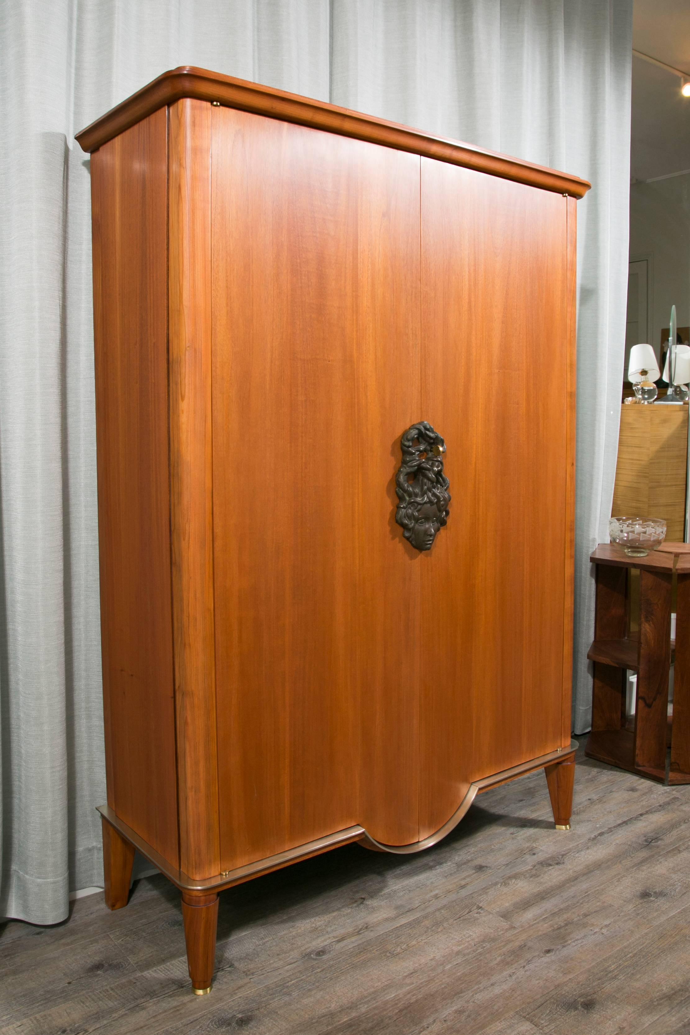 Exceptional armoire by great French designer of 20th century Andre Arbus (1903-1969) with a sculptural bronze keyhole by Vadim Androusov (1895-1975)

Documented in Yvonne Brunhammer, 