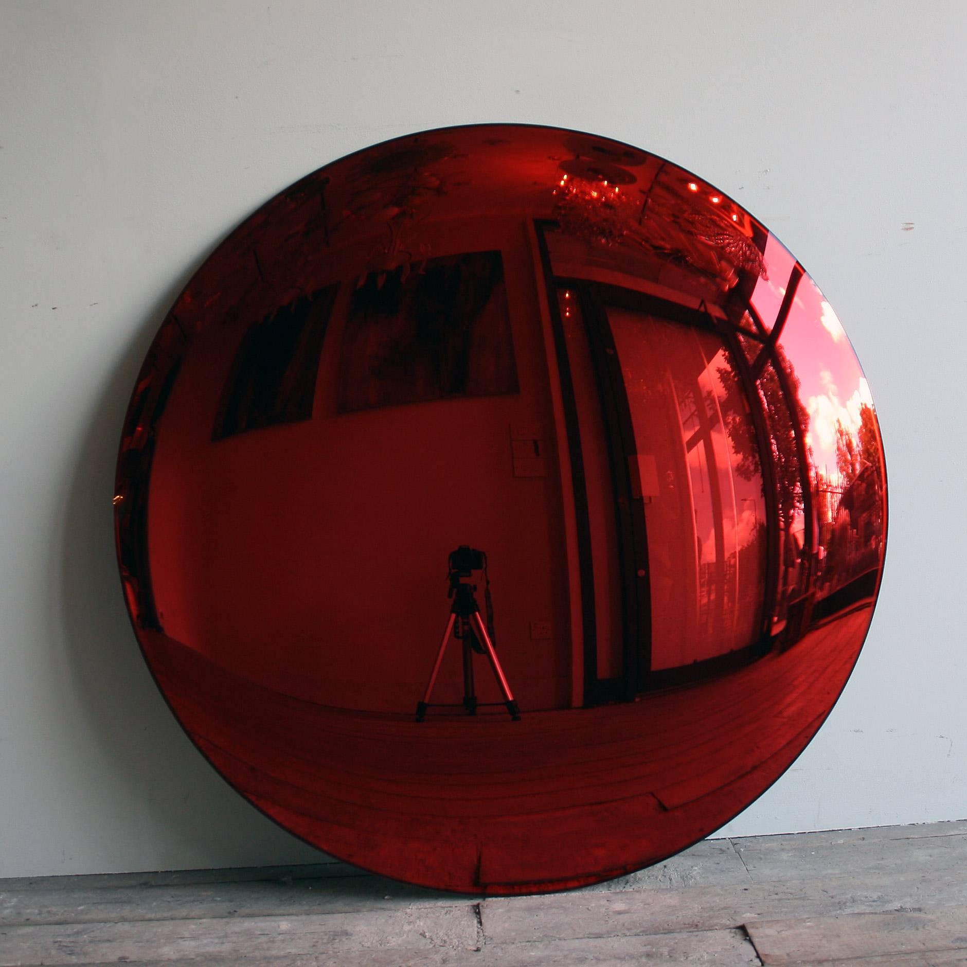 A large Red convex mirror 100cm in diameter with three bespoke clips for wall installation. A real statement piece!

All color mirrors have a two - three week lead time as all made to order.

As each mirror is bespoke made, will need a 50% deposit