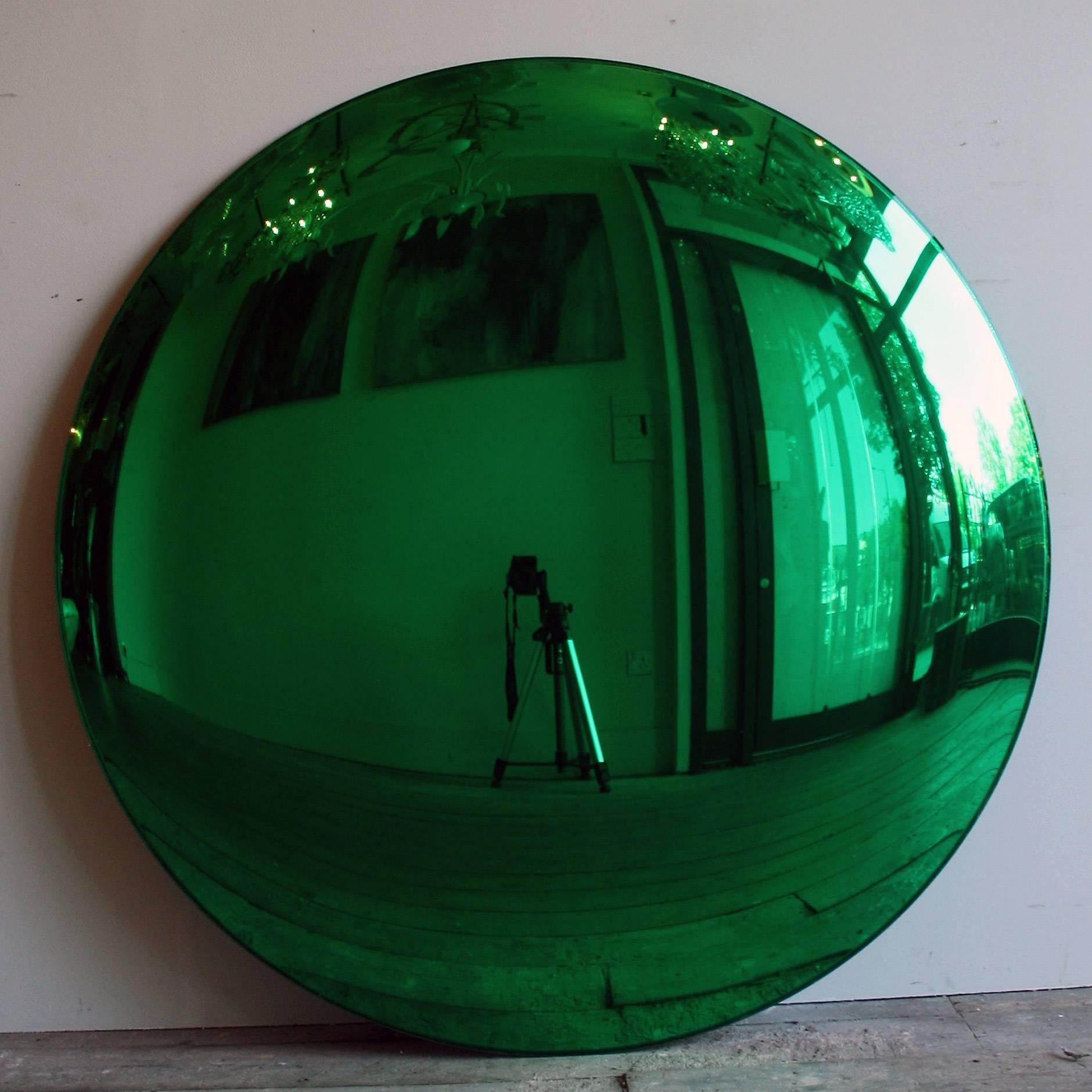 A large Green convex mirror 100cm in diameter with three bespoke clips for wall installation. A real statement piece!

All colour mirrors have a two - three week lead time as all made to order.

As each mirror is bespoke made, will need 50% deposit