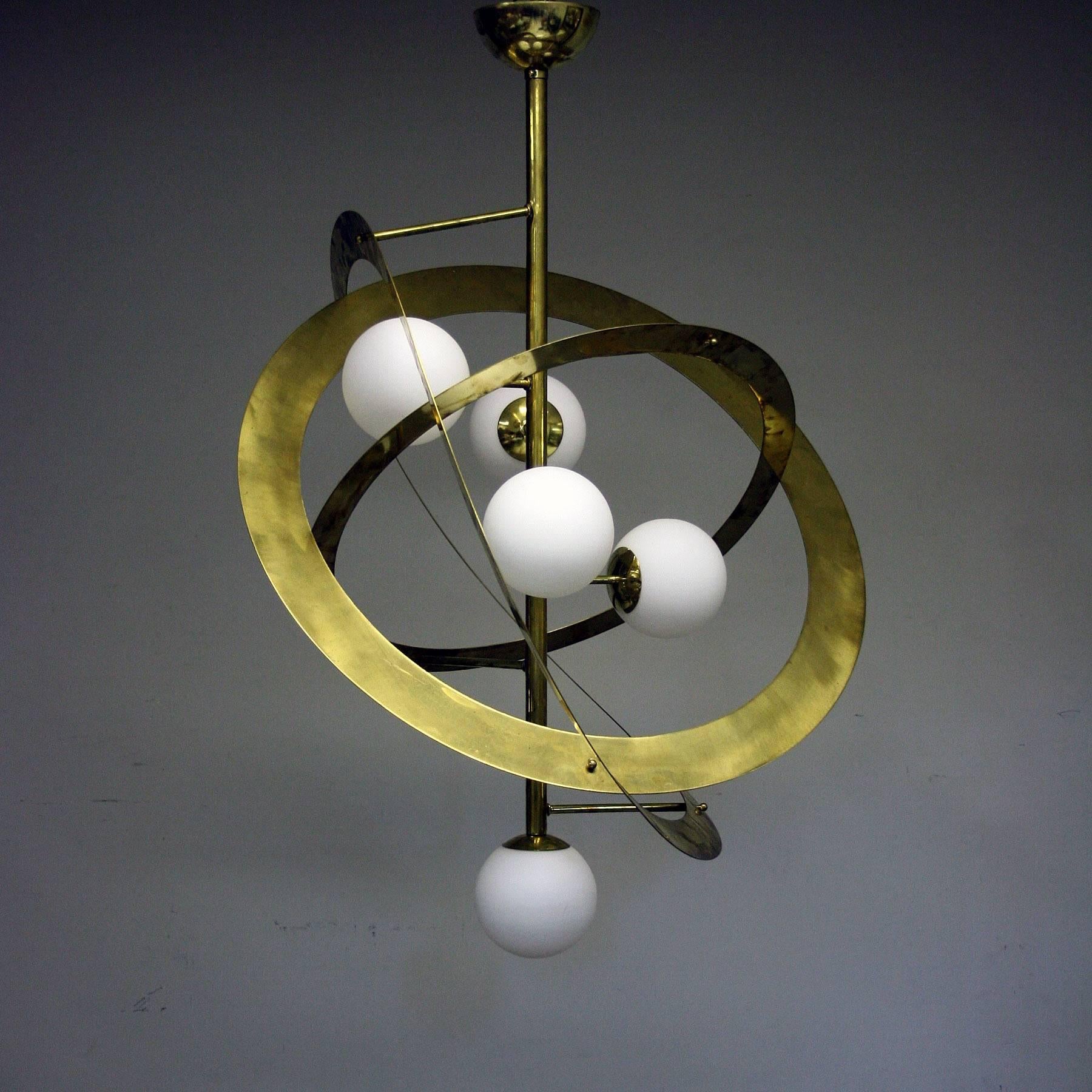 You can now sit in your lounge and look up at the solar system with this handcrafted Bespoke Italian brass chandelier with five frosted glass balls in the manor of the solar system, this really is a statement light and would be the talking point of