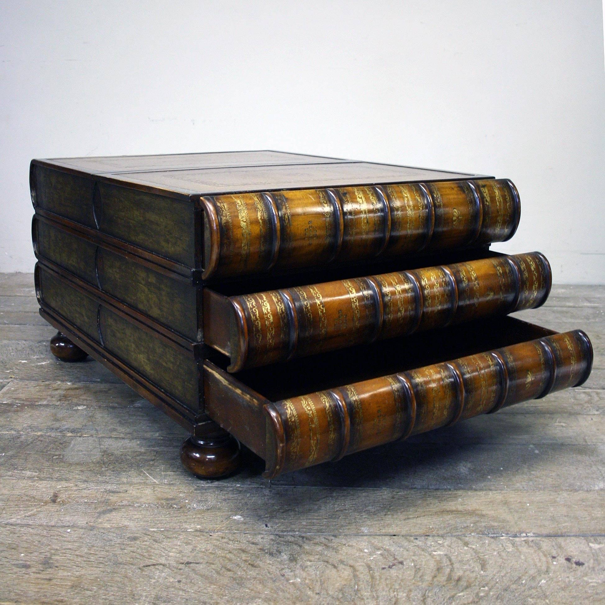 A late 20th century stacked book coffee table with leather top, six hidden drawers in fantastic condition by Maitland-Smith.