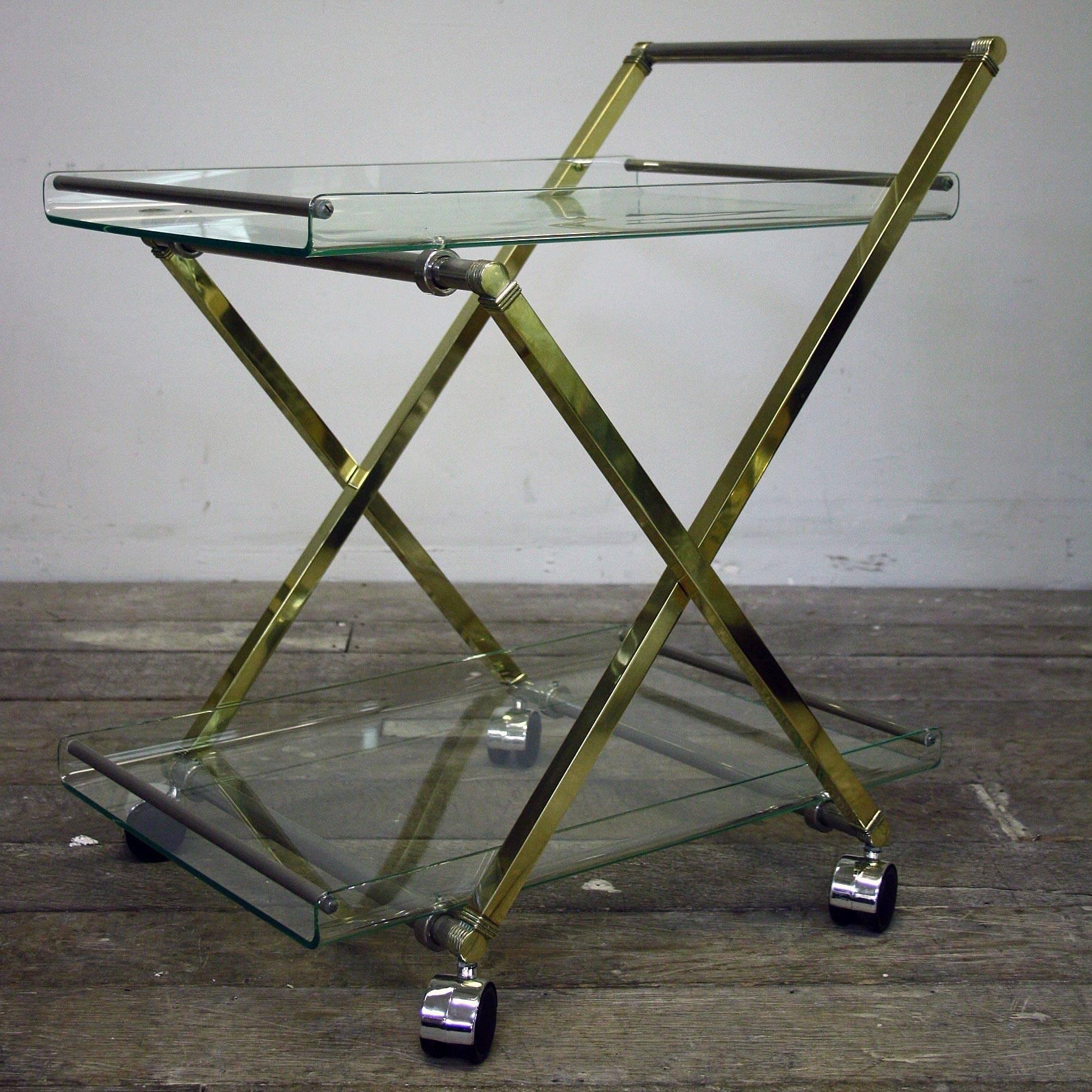 A very stunning Ghyczy compact two tier late 20th century drinks cart, with brass and chrome fittings and Lucite shelving.