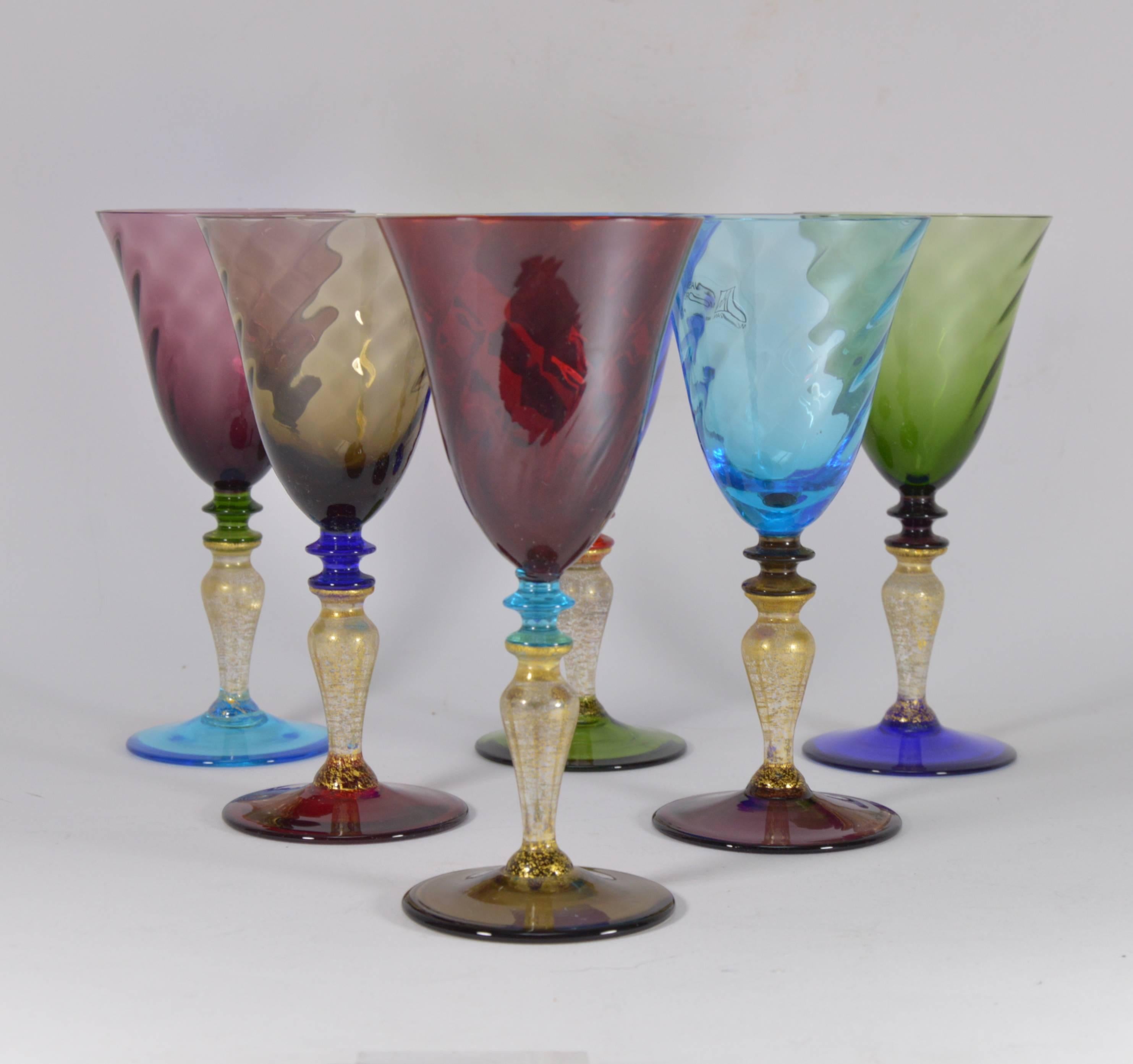 Set of six Murano Art glass wine glasses by Nason and Moretti. Gilt stems.
Perfect condition. Measures: Height 18.5 cm.