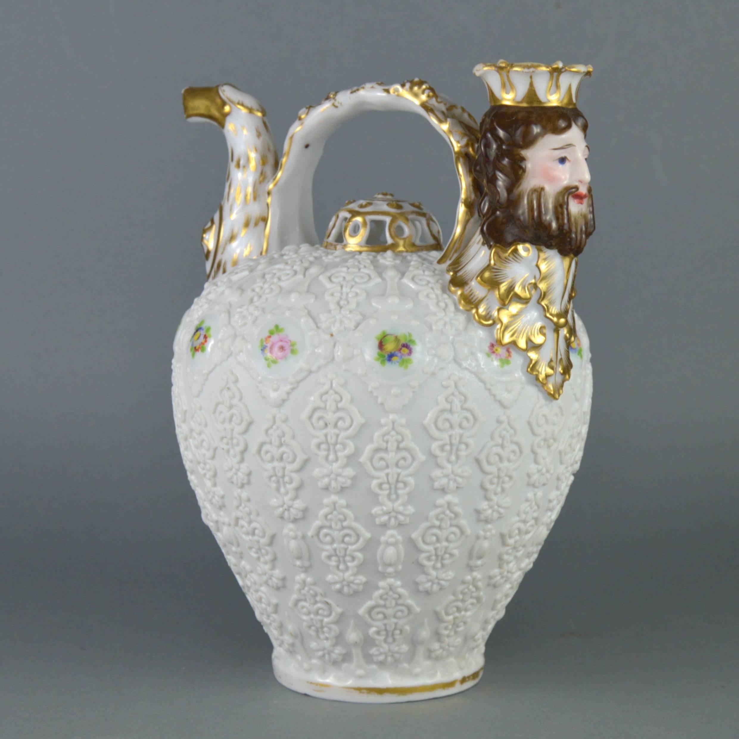 Rare collectible porcelain pitcher by important Paris manufacturer Jacob Petit (1840s). The white biscuit oviform body modelled with glazed roundels painted with flower-sprays amongst scrolling arabesques. The spout modelled as an eagle head.