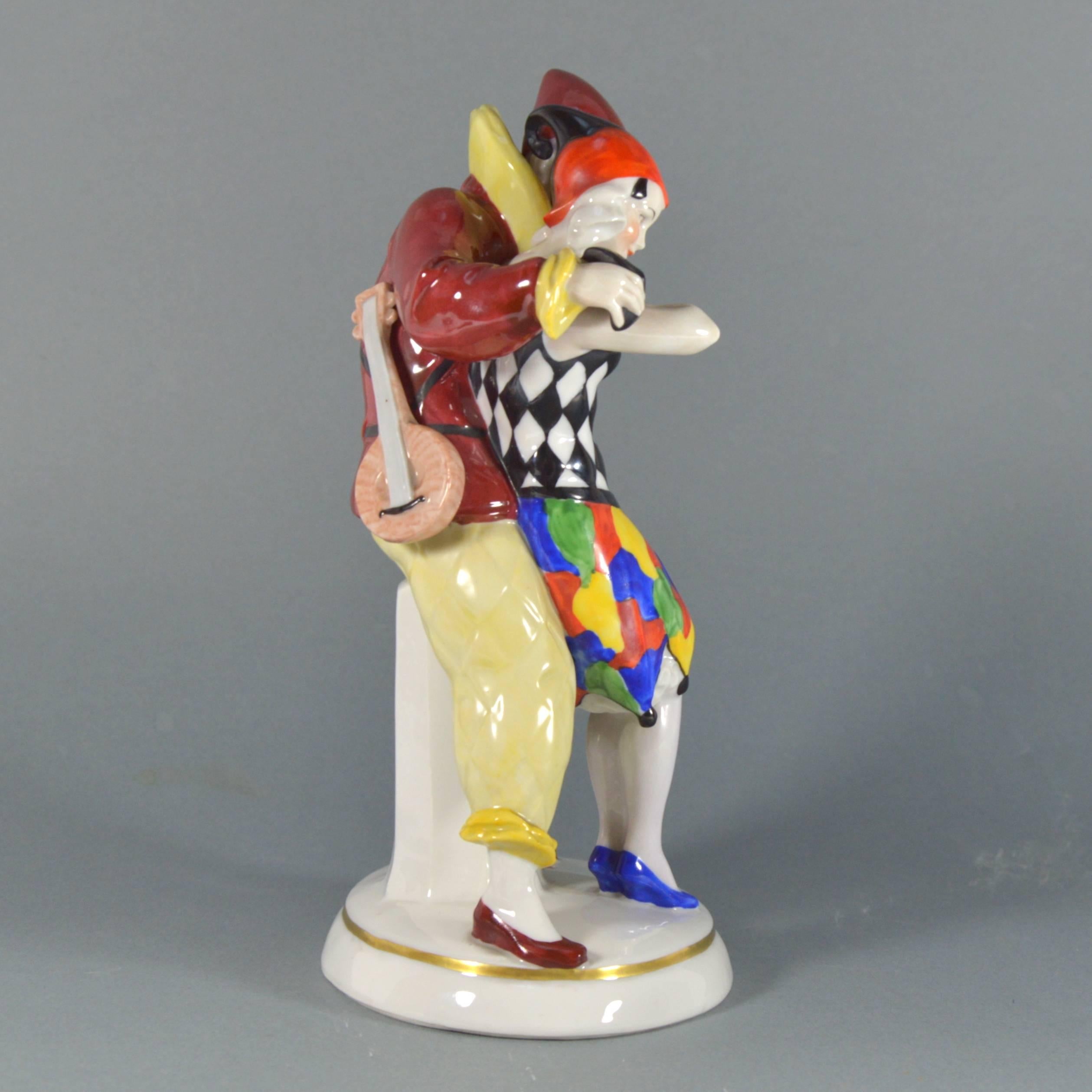 Gorgeous porcelain figurine group: Harlequin and Columbine deriving from Commedia Dell’arte. By German Manufacture Katzhutte.
Blue over glaze mark used between 1914 and 1945.

Measures: Height 23 cm (9 in).

Perfect condition, no cracks, chips