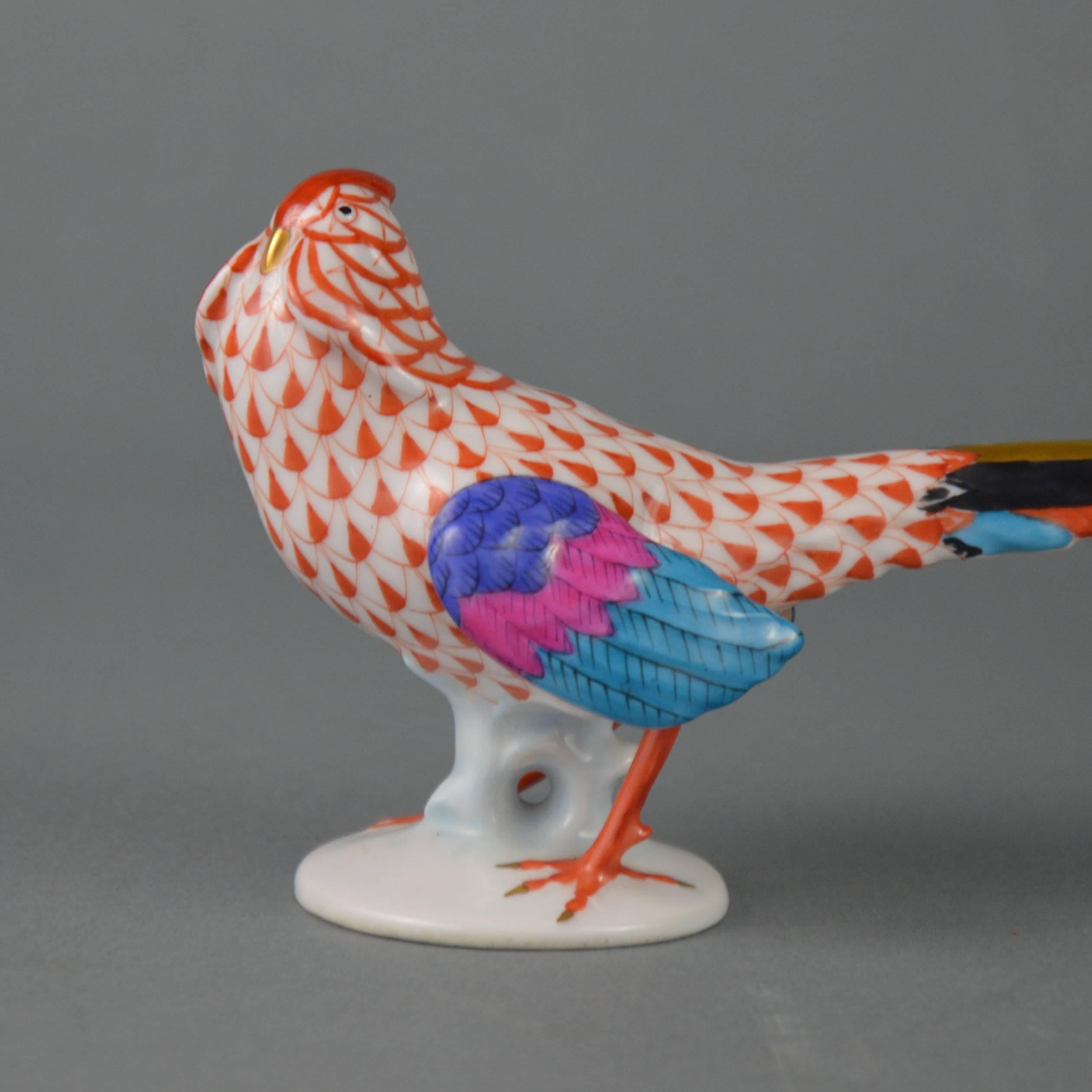 Herend (Hungary) porcelain pheasant figurine decorated with their famous hand-painted fishnet pattern.
Measure: Length 21cm, height 7.5 cm.