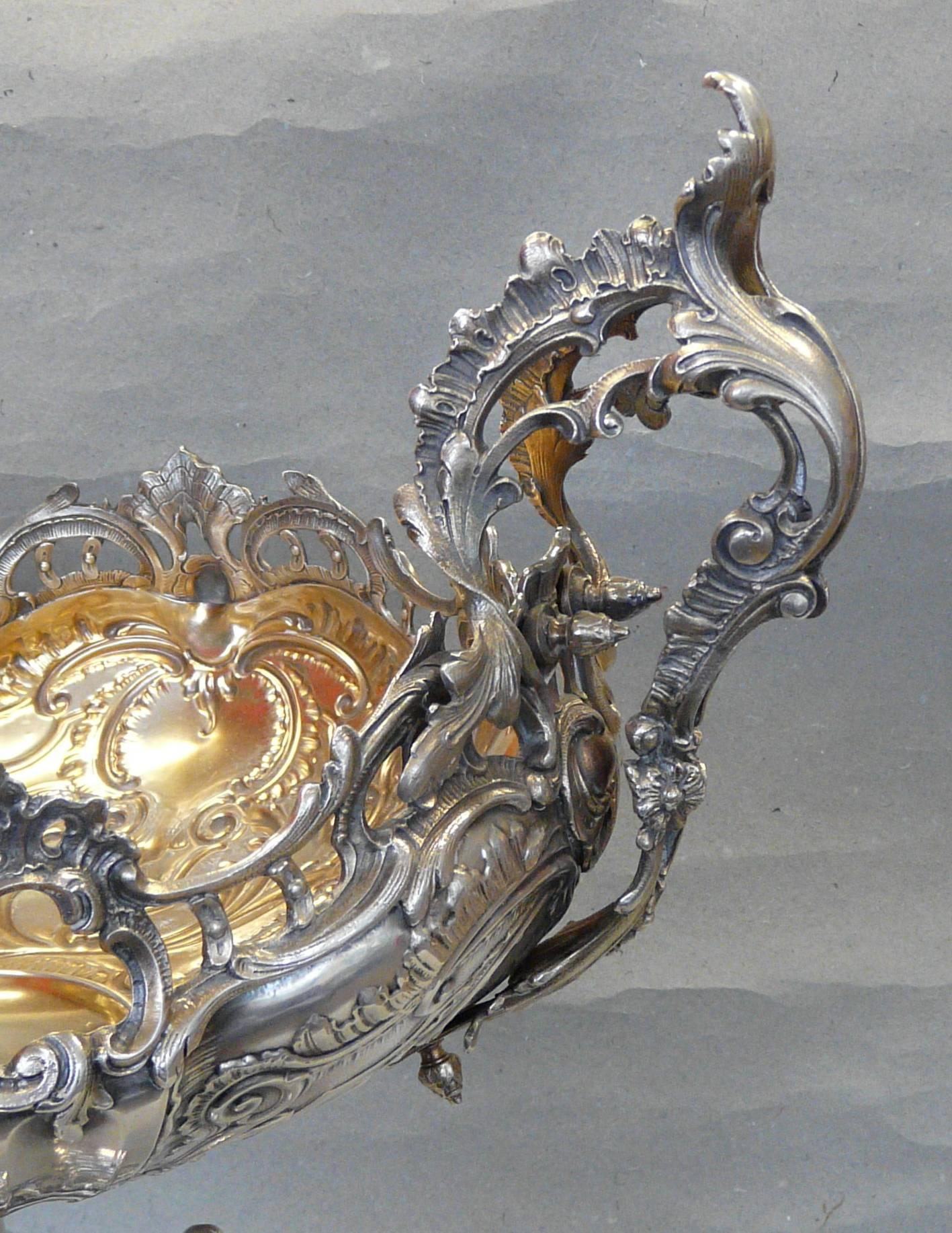 Large late 19th century Baroque style silver plated centerpiece. Gilt inside.
Measure: Height 60 cm, length 47 cm.