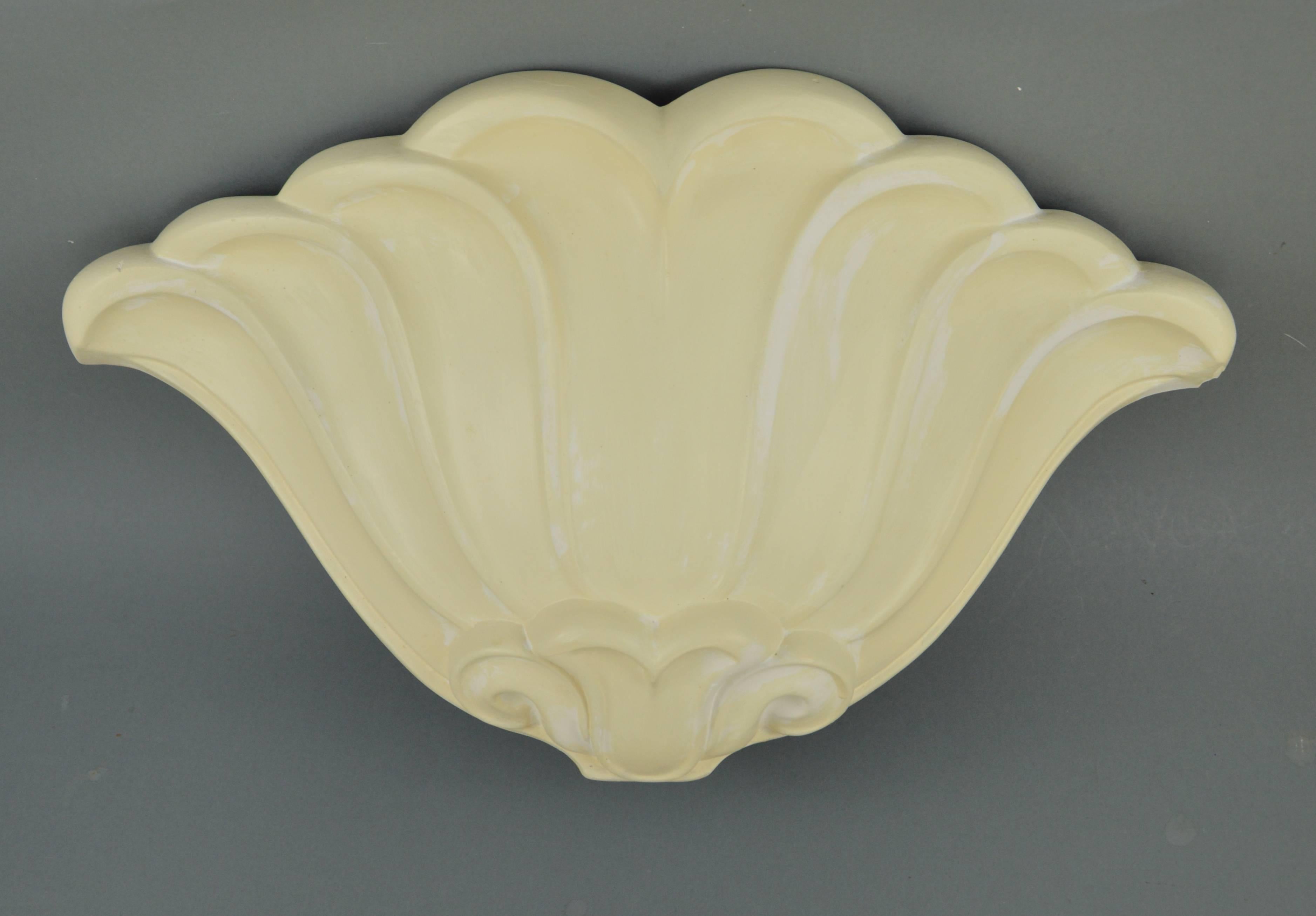Set of four Art Deco coloured plaster cast wall lights. Belgium, 1920s-1940s.
Dimensions: 61 x 35 x 13 cm.
Condition report: small chips, electrification holes at the back.