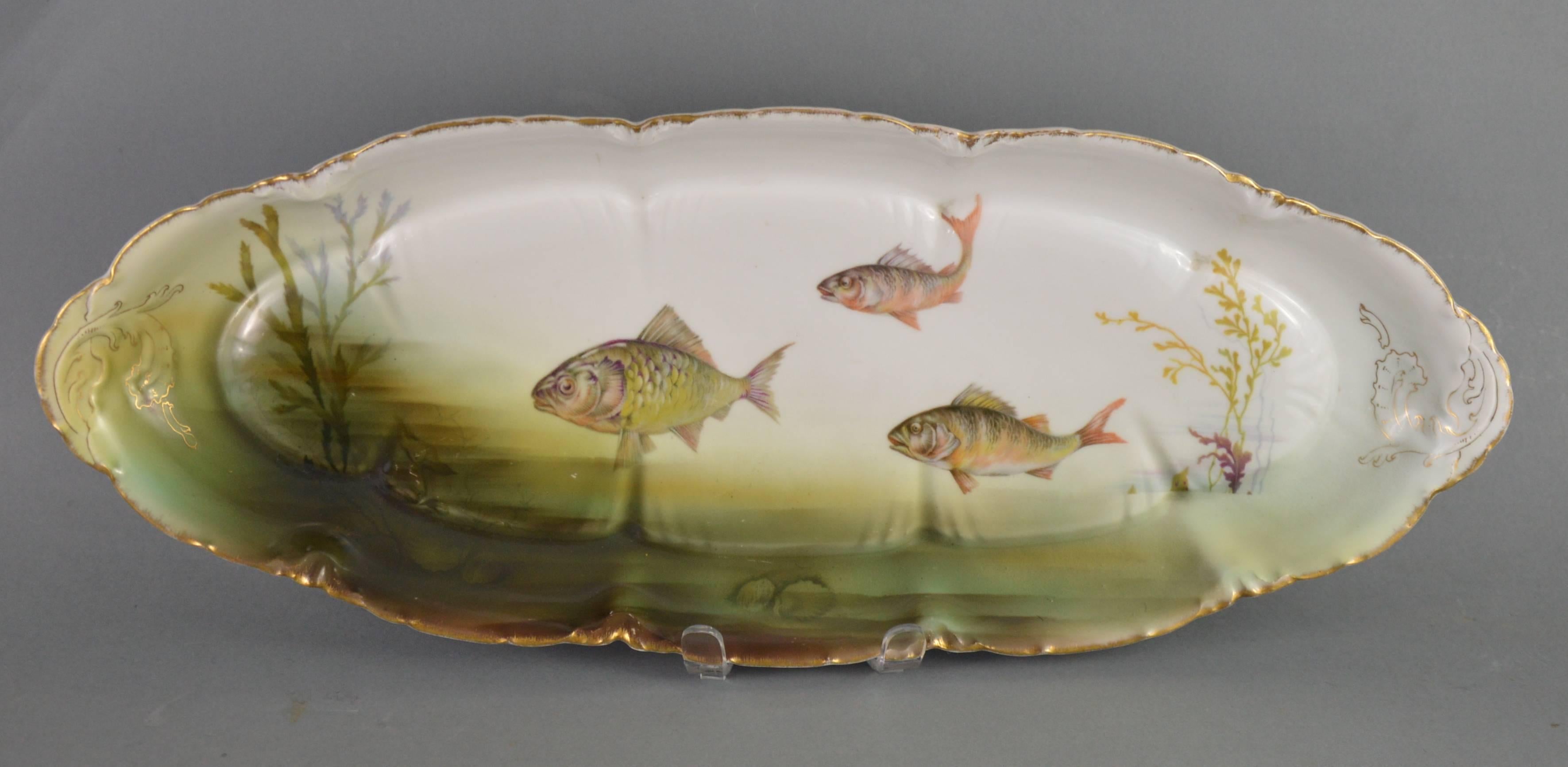 Antique Rosenthal porcelain fish service. Large dish and ten plates.
Provenance: Rosenthal, Germany.
Period: circa 1910.
Medium: porcelain.
Dimensions: dish 59 x 23 cm, Ø (plate) 23 cm.
Condition: Good condition, no cracks, no chips, no