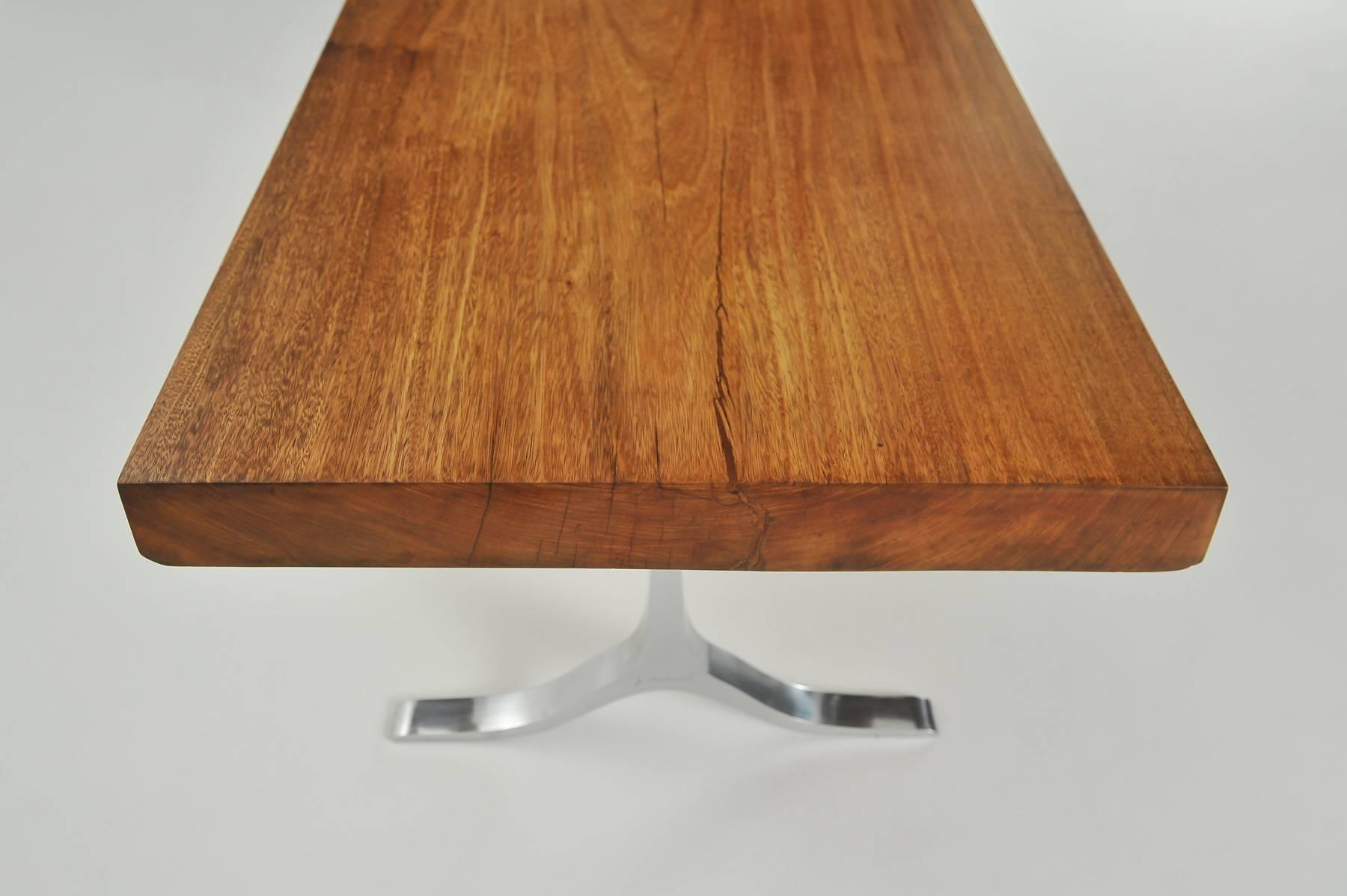We created this table for a French client, who was looking for a hyper-sleek table for his livingroom. It should look like a console, but desk-height. He wanted a very neutral base, so focus would fall on the wood. He loved.

Model: