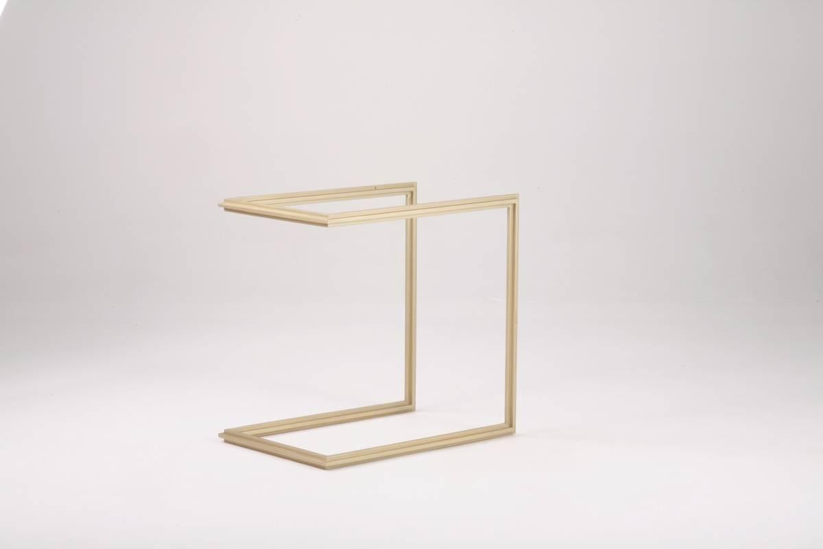 Model: PT5
Frame Material: Brass
Frame Finish: Golden Sand
Top: Tempered Glass
Top Finish: Mushroom
Dimensions: 33 x 47.5 x High 47 cm
(w x d x h): 13 x 18.7 x High 18.5 cm

This is one of the first P. Tendercool designs, inspired by Mies