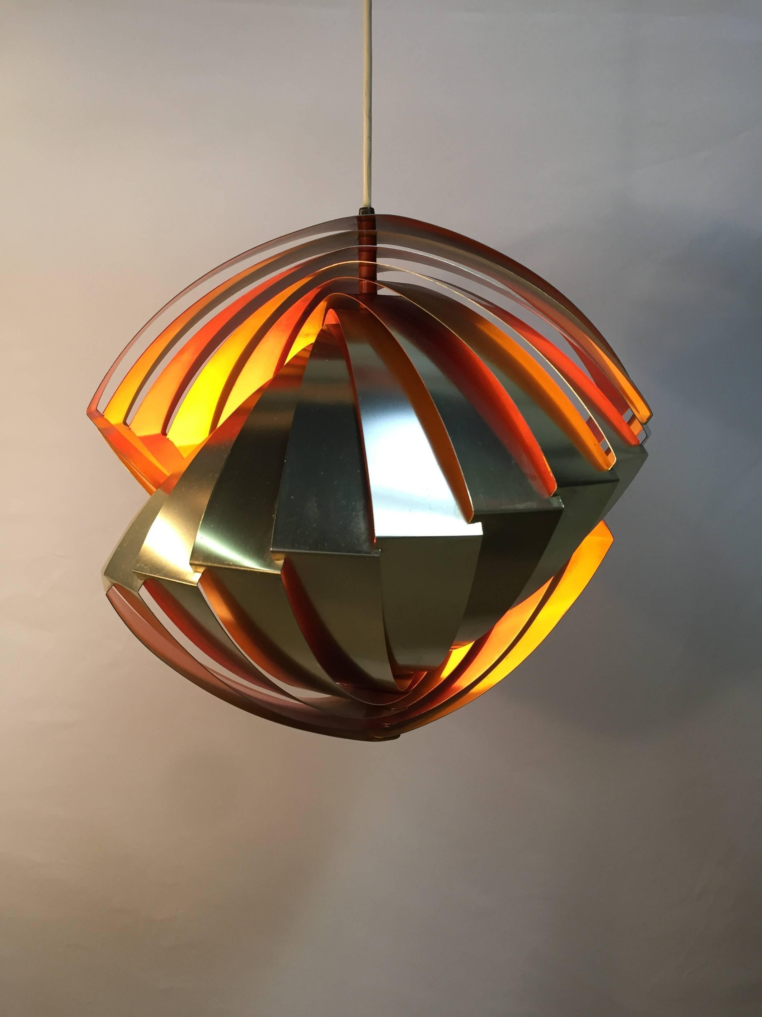 The iconic "Conch" pendant, was designed by Louis Weisdorf in 1964 for the Tivoli Garden in Copenhagen. Reputed to be Weisdorf's first design and limited in production numbers due to high manufacturing costs, these lights are difficult to