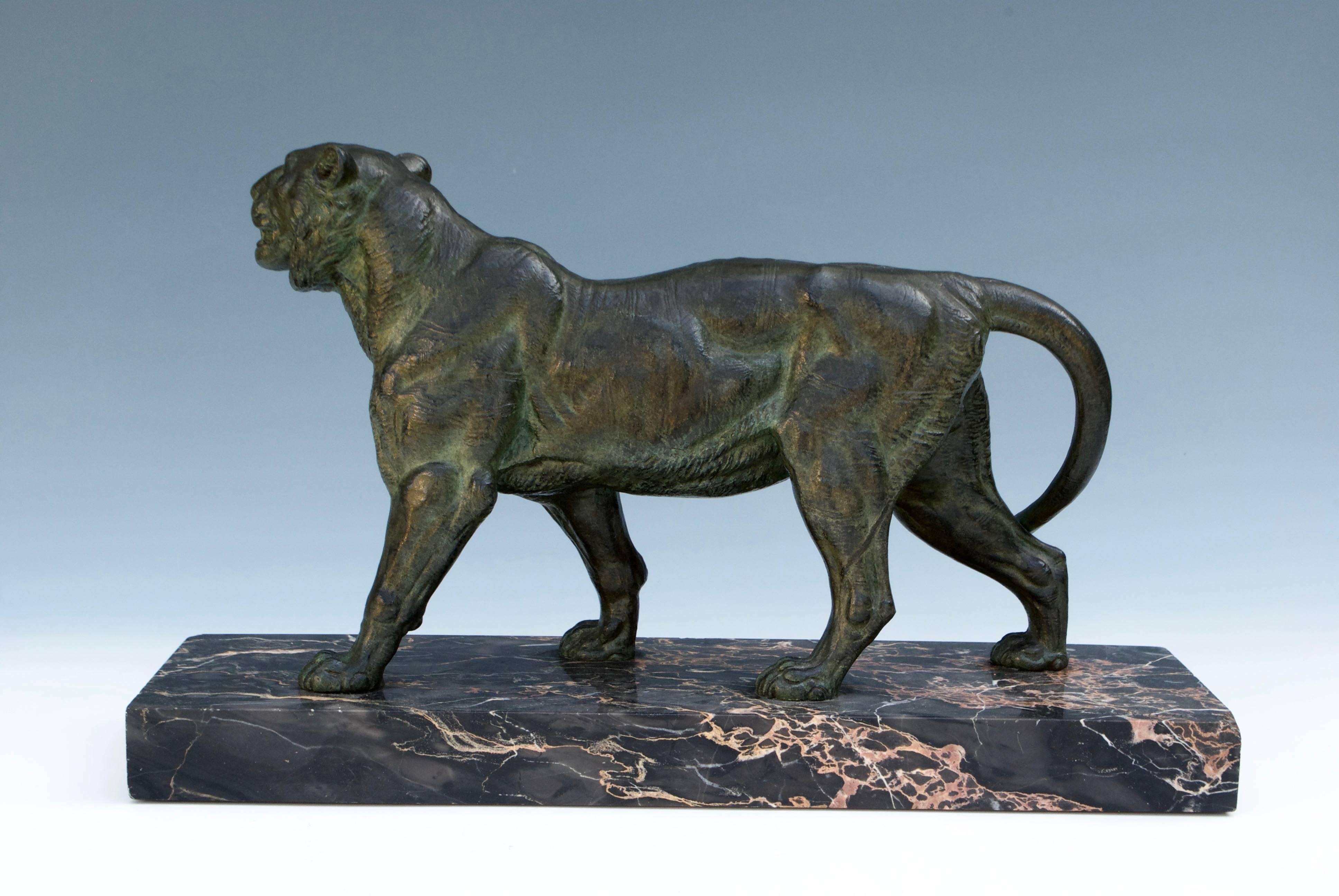Paul-Édouard Delabrièrre (1829-1912)
An elegante bronze tiger with green patina on marble base. 
Signed on the right side of the base.