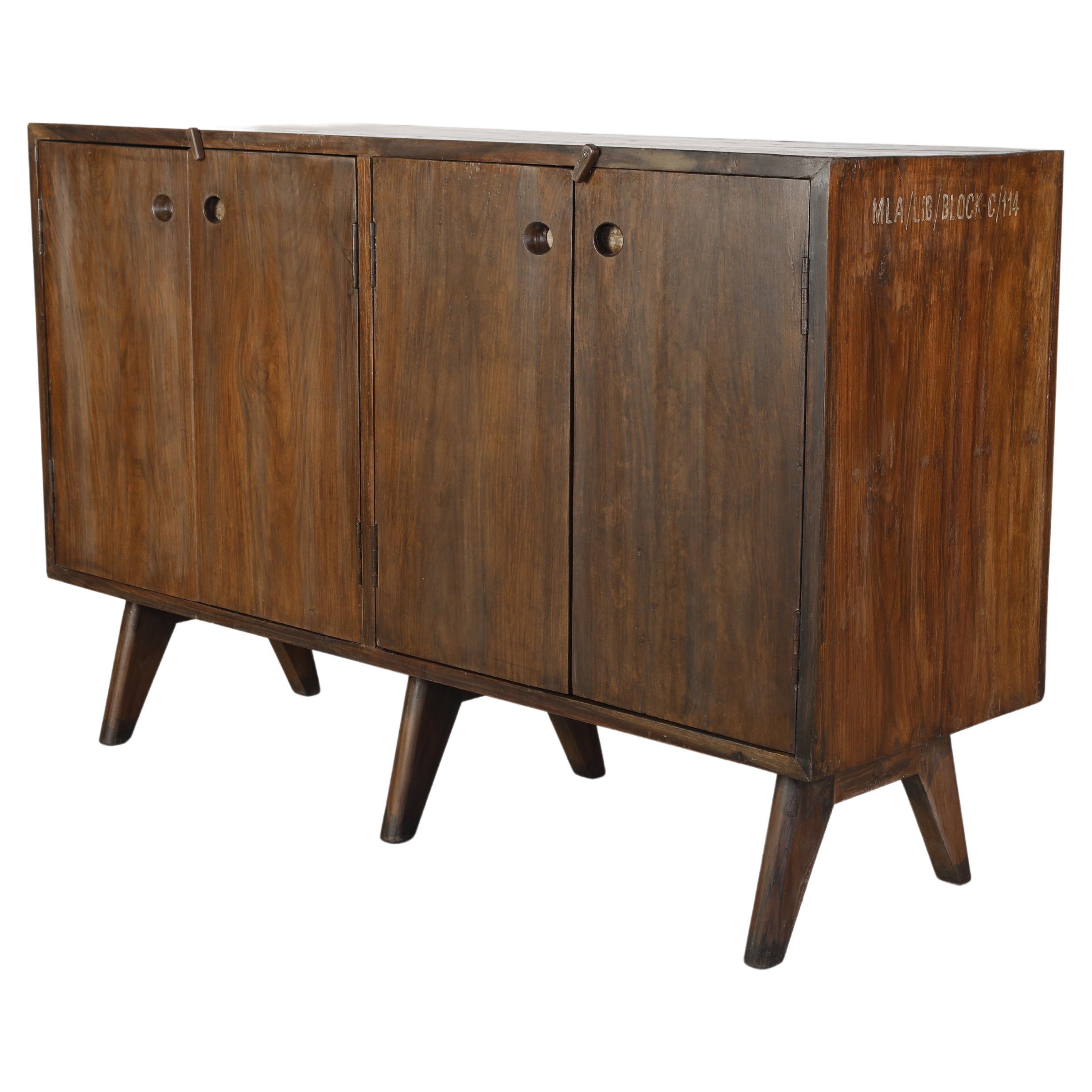 This cupboard is a fantastic piece of solid yet elegant furniture. It is raw in its simplicity of construction, its shape becomes reduced to a maximum of functionality. The characteristic legs, combined with the warmth of the solid teak wood make it