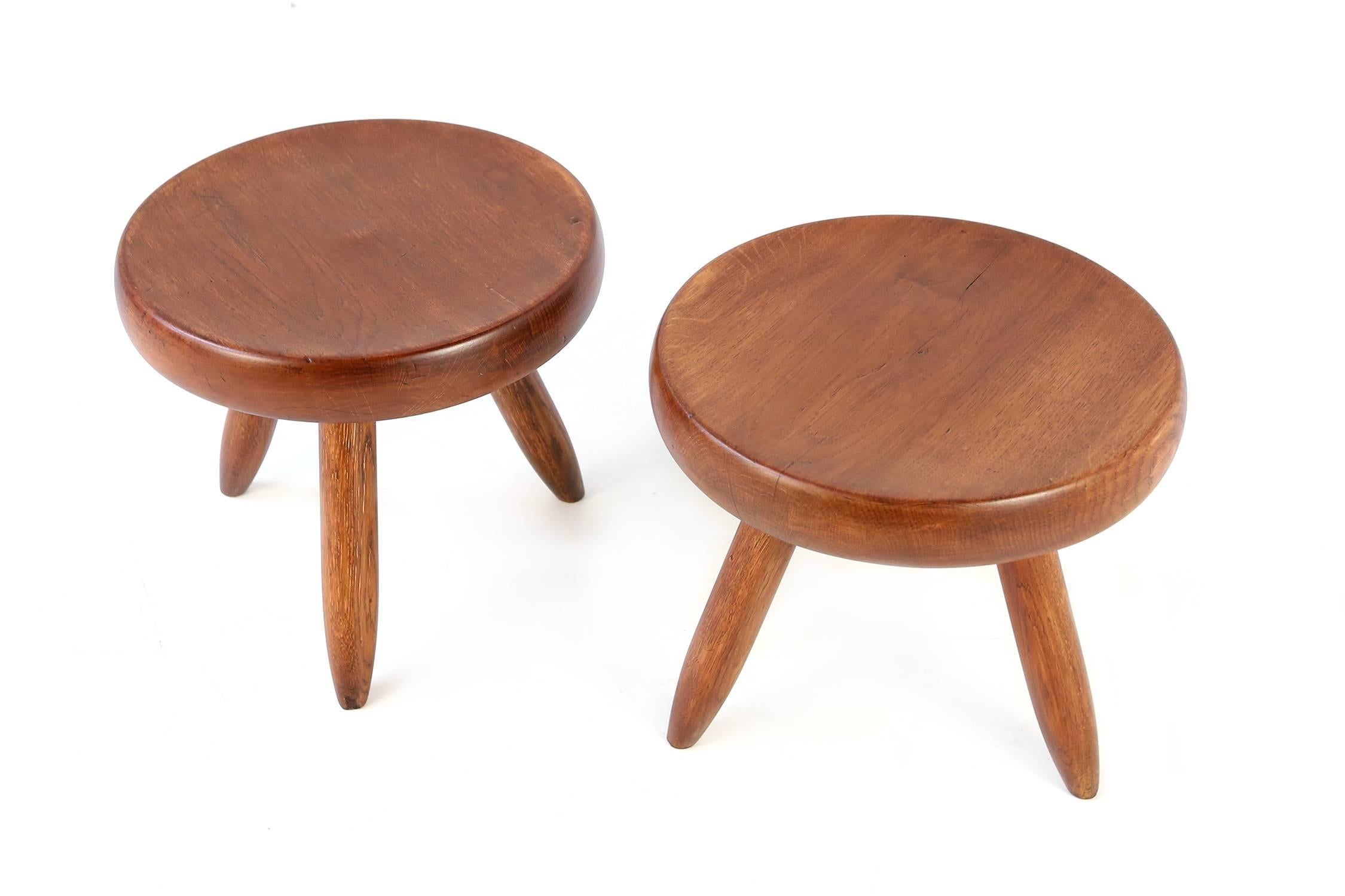 Low stools designed by Charlotte Perriand in the 1950s for Steph Simon. Original condition, preserving a beautiful patina.
  