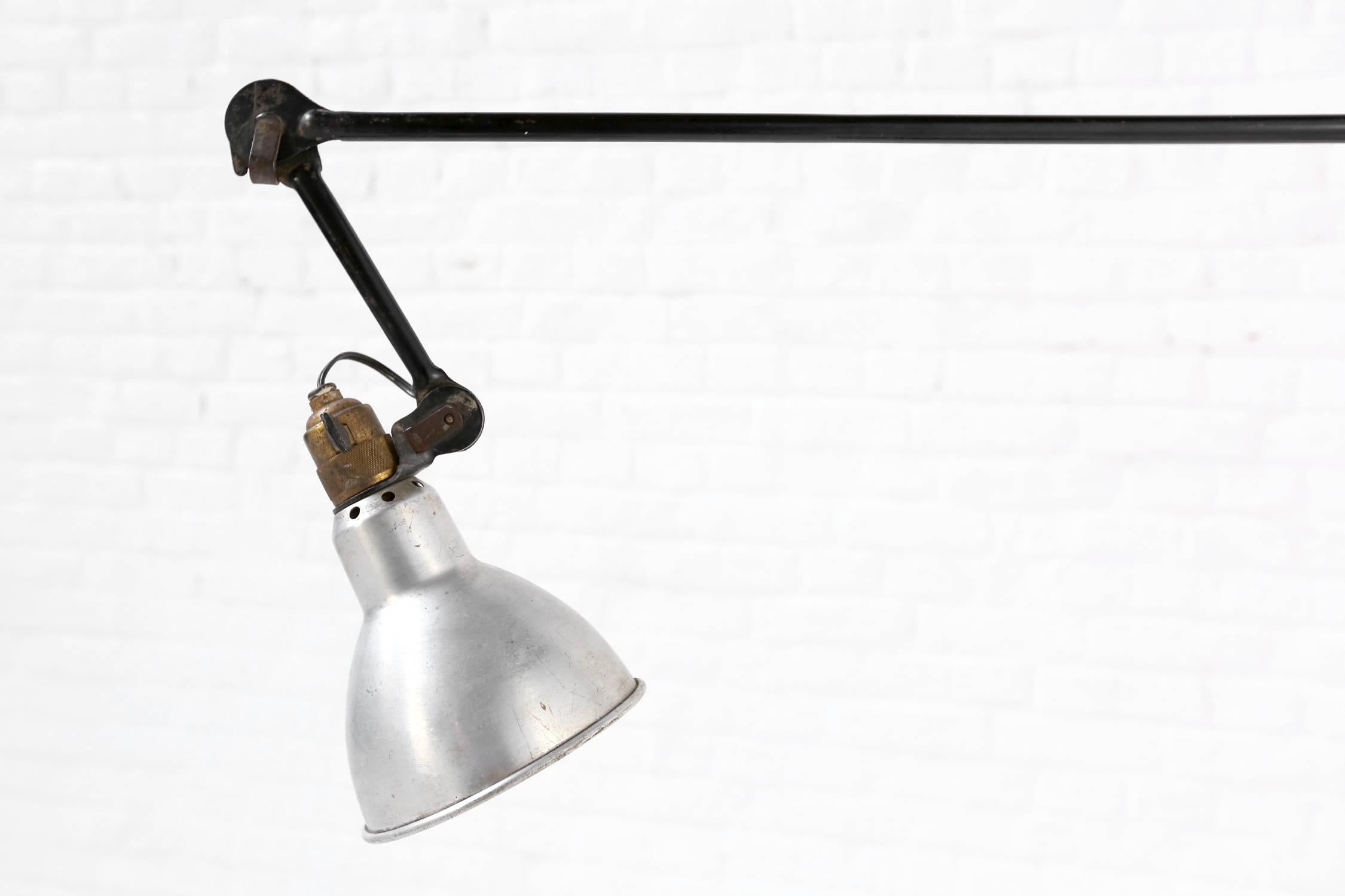 Rare gras 215 floor lamp from the first series with the base and column (terminating in a point) in enameld steel. The lamp is fully adjustable and articulating.
A small piece of the cast iron part is missing (see pic 6), but does not affect the