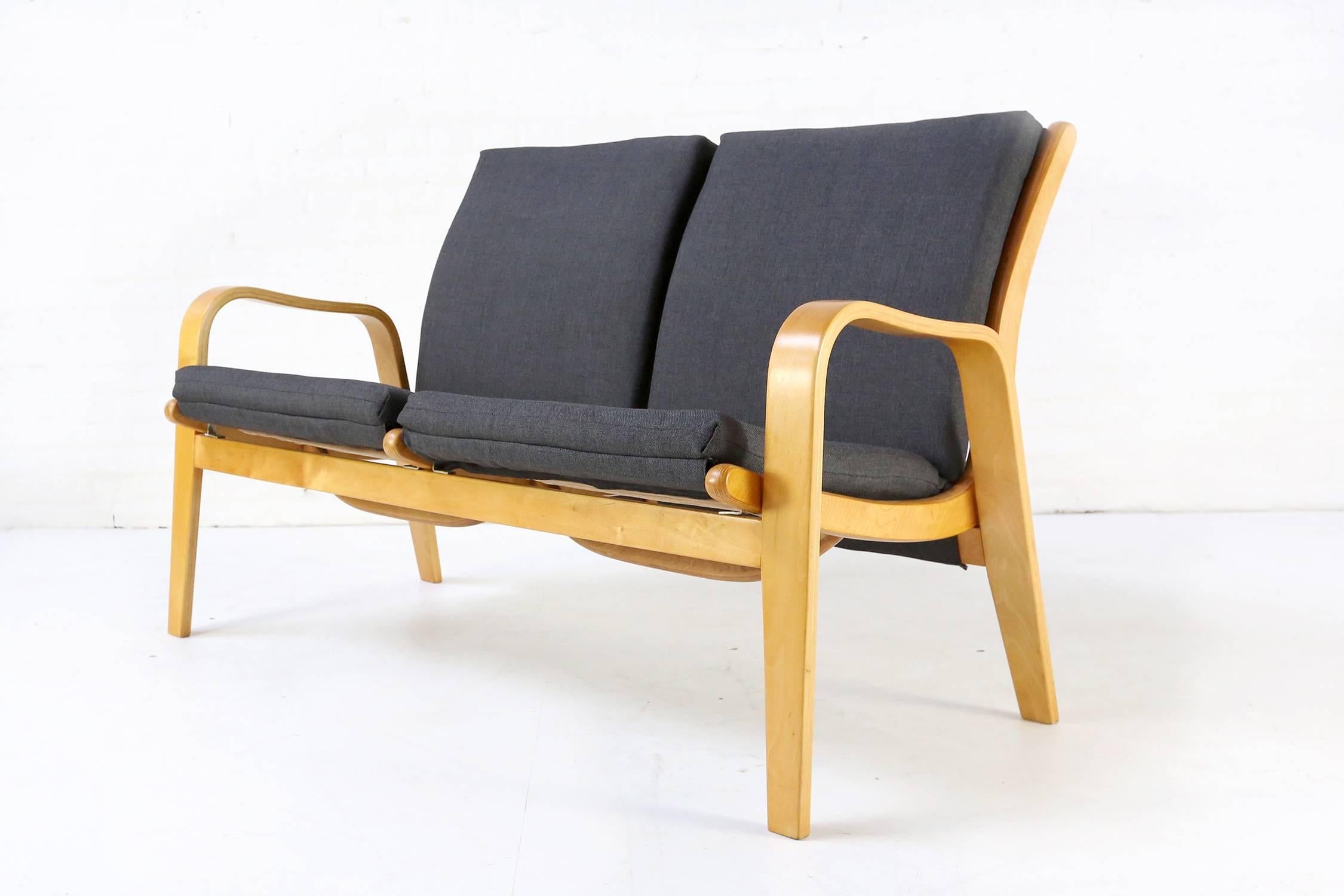 Very nice sofa set designed by Cees Braakman during the 1950s for Pastoe
Definitely influenced by Alvar Aalto, this bent birch framed loveseat and two easy chairs have new upholstered cushions and foam. Plywood is recently refinished and has a
