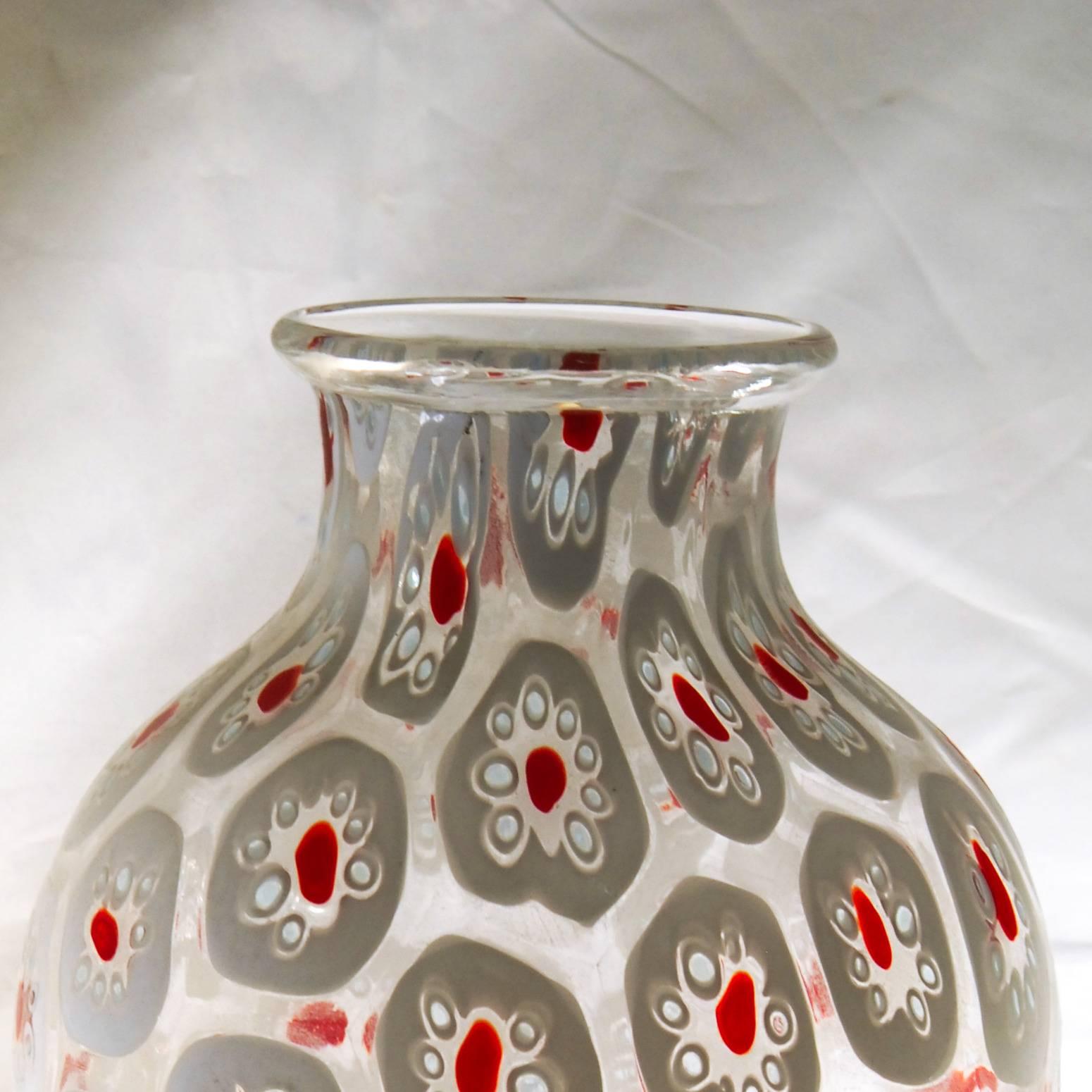Beautiful large murrina vase from Pavanello, with the red dots making the design contemporary. Heavy and unique. The Murrinas are surrounded by clear glass, allowing you to see through the piece.

This is the typical shape and work of Pavanello. I