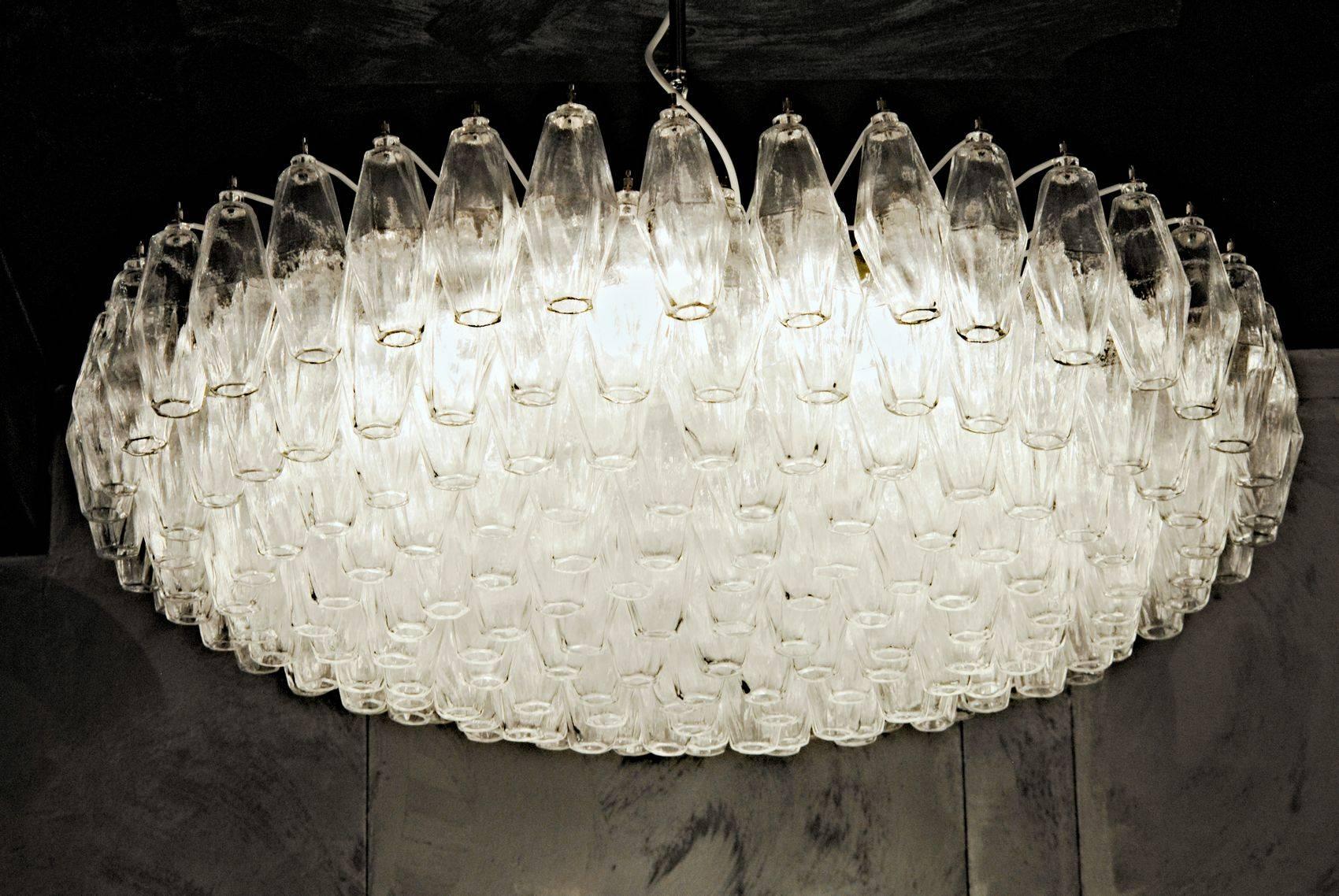 Sumptuous exemplary Mid-Century chandelier. For large a large hall, ballroom or public spaces. Would be stunning in a large midcentury living room or an eclectic home. This triedri chandelier is only in clear crystal glass, the two color combination