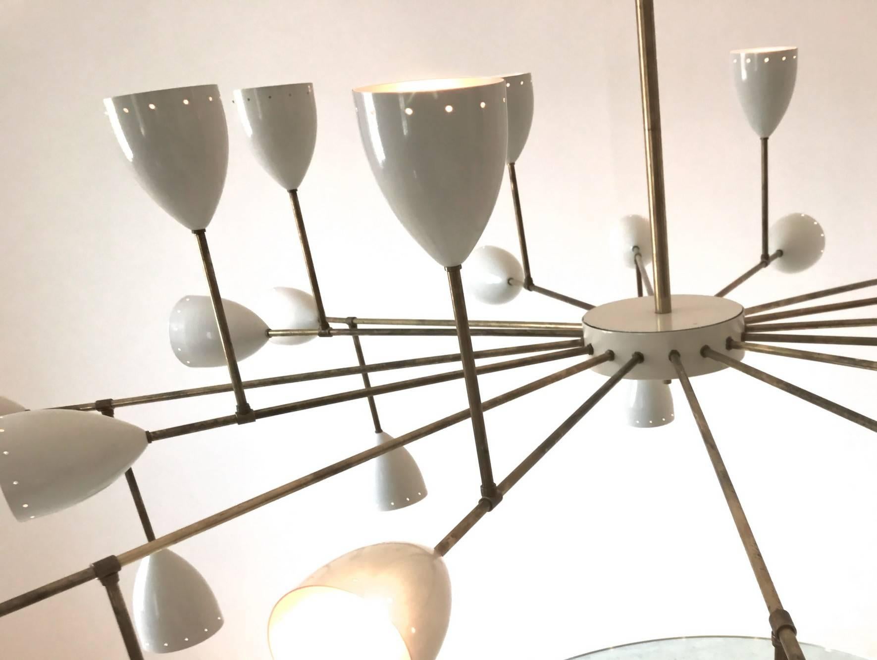 For a large room, a hall or an urban loft. This midcentury style chandelier has 32 lights.
Branching chandeliers has the limit of dim light output, this has finally the right design for getting a great light output.

Midcentury sixteen 16 arms