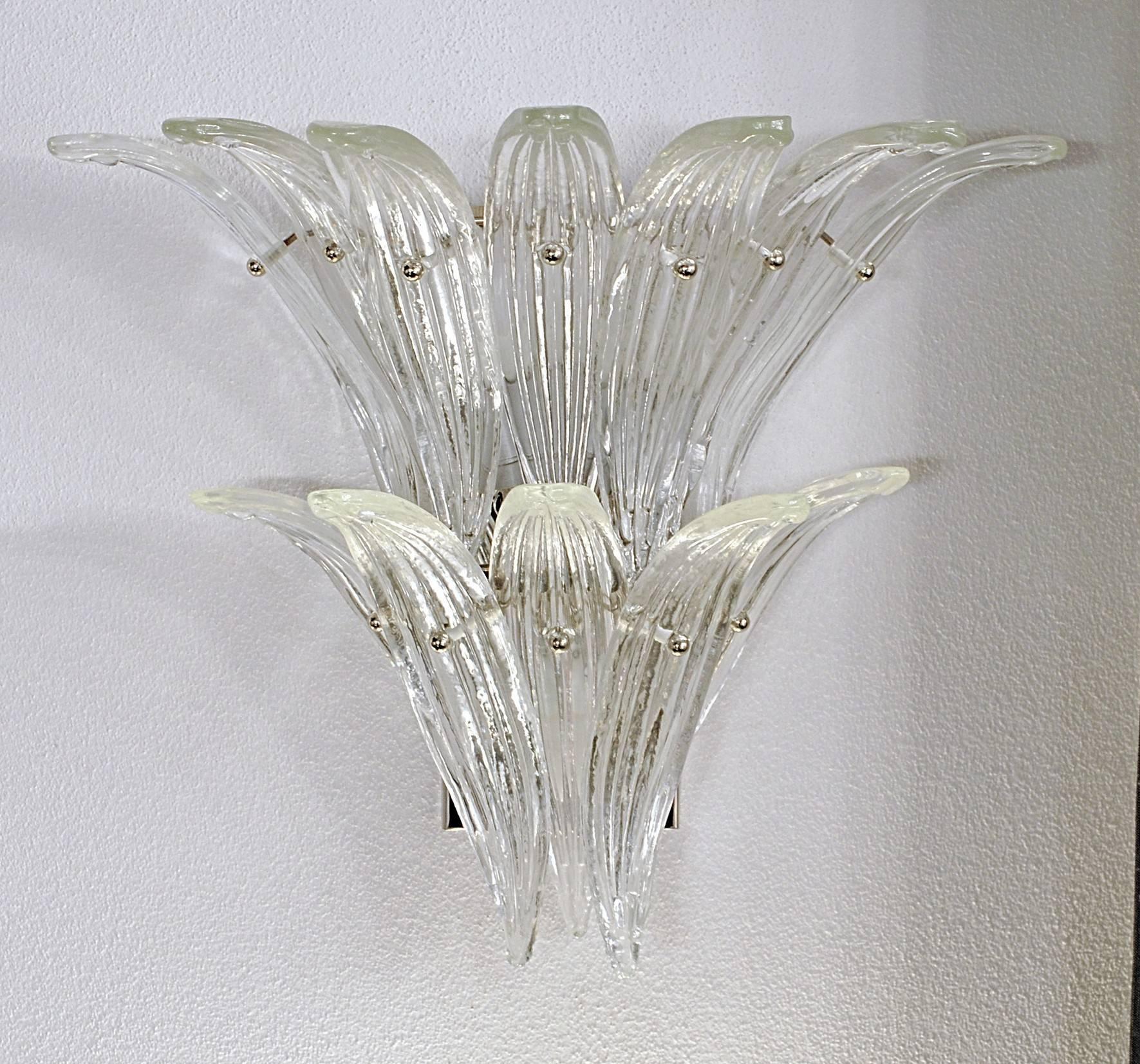 Four charming palmette sconces. Each carry 12 palmette leaves and three candelabra socket. Clear glass, chrome hardware.

Identifications, references: Unknown origin. Other sellers are quoting it as Barovier or Venini. Probably the first is more