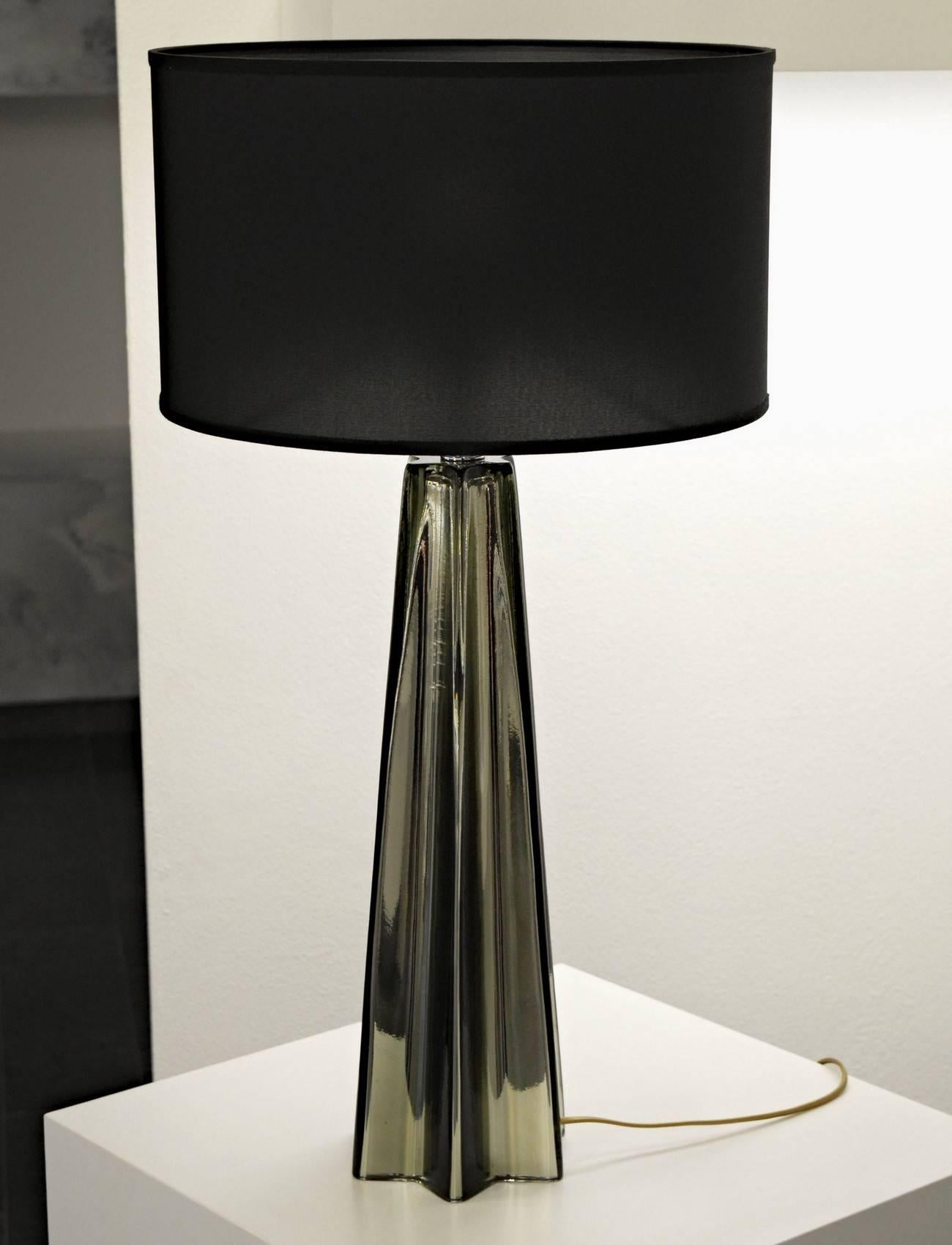 Fashionable pair of tall table lamp from Alberto Donà in Murano. Gray acciaio color layered inside with mirror mercury glass technique. Geometry of shape plays well with light reflection making a wonderful effect when the shaded lamp is lit.