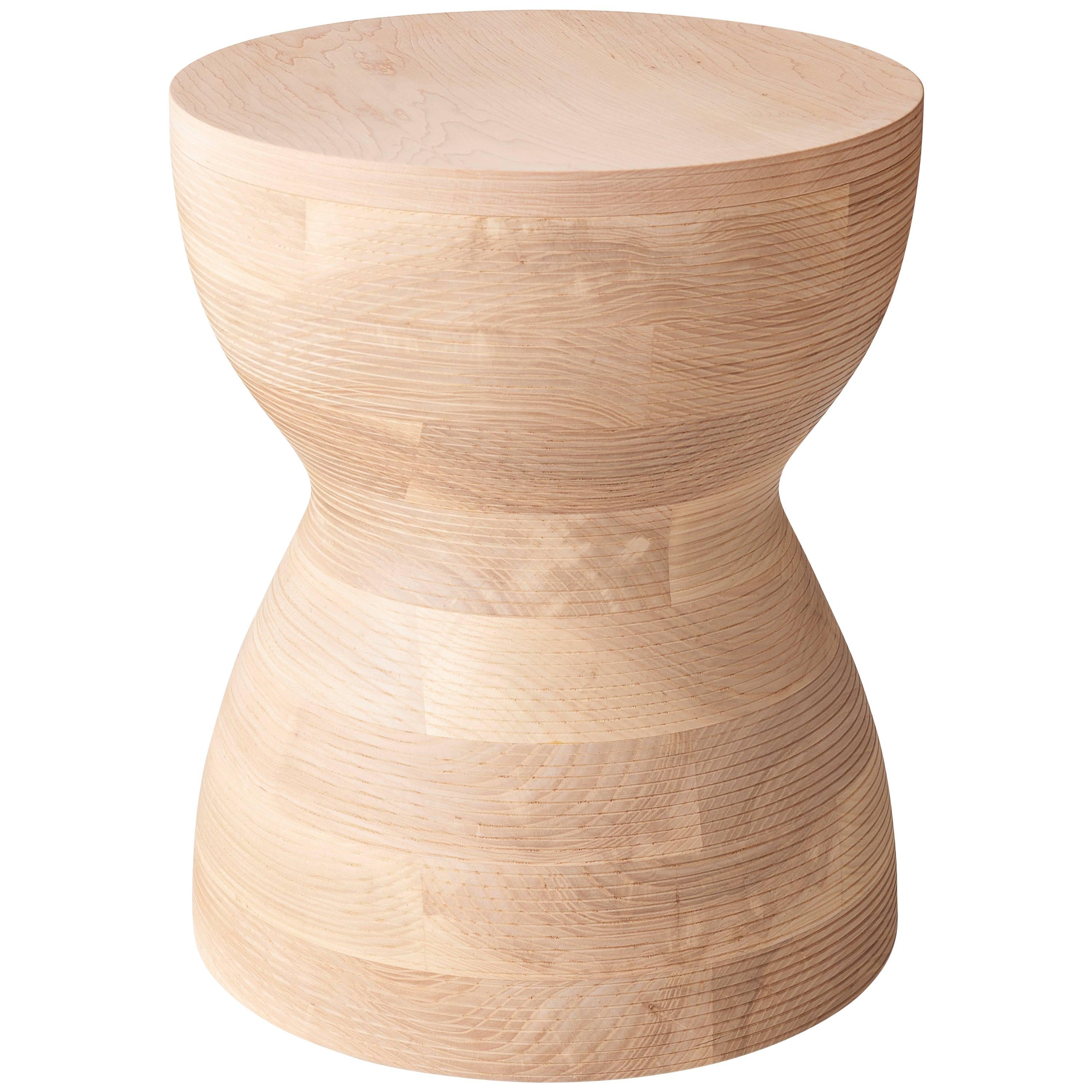 Stacked lamination of ash hardwood with walnut top, turned on a lathe. This pleasing sculptural object can be used as a side table or stool for seating. Available in black, natural, blue or red. They are made of solid American hardwood and have the