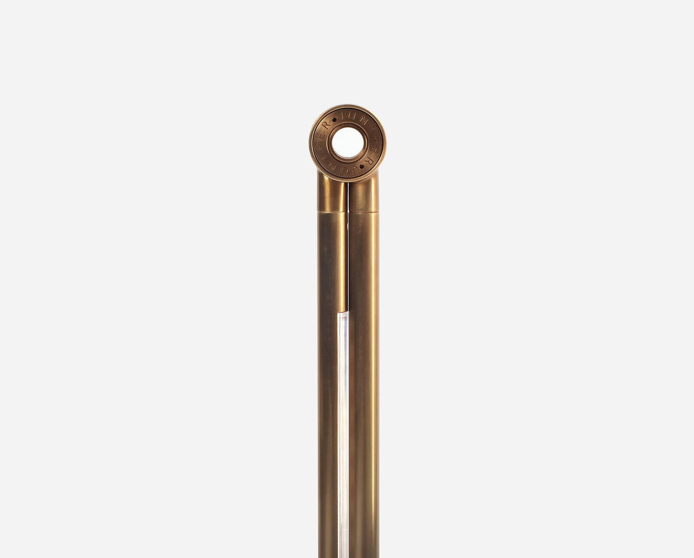 It’s thin profile is contemporary, while brass details and tubing combined with a cast iron base create a timeless and friendly feel. The lamp’s slender arms stretch across a work surface without taking it over and the mounted ball joint and