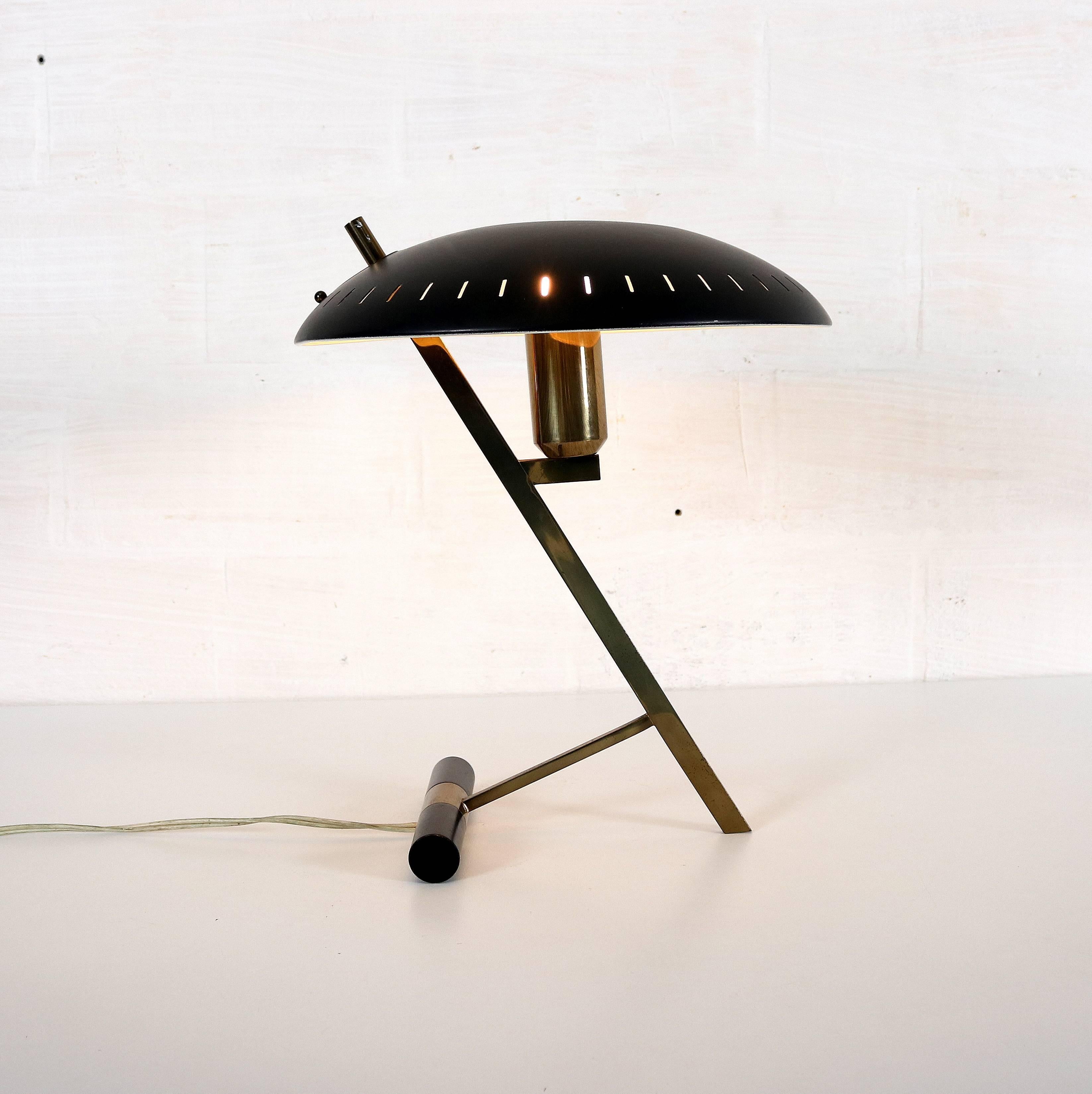 Desk lamp by designer Louis Kalff for Philips.
With brass base and black painted metal lampshade.
In a good vintage condition.