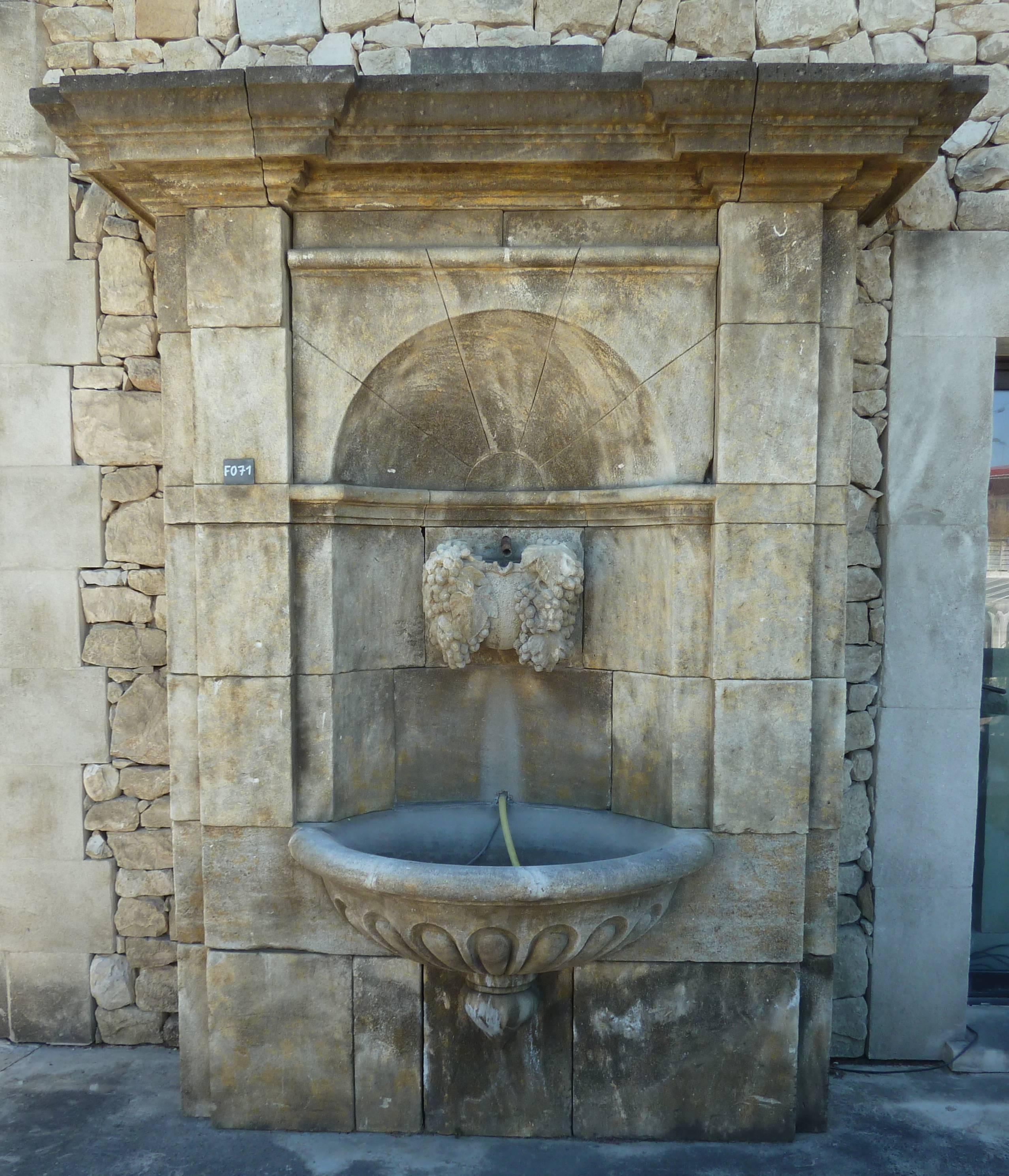 Hand-Carved Impressive Wall Fountain in French Natural Limestone with Hand Sculpted Vine For Sale