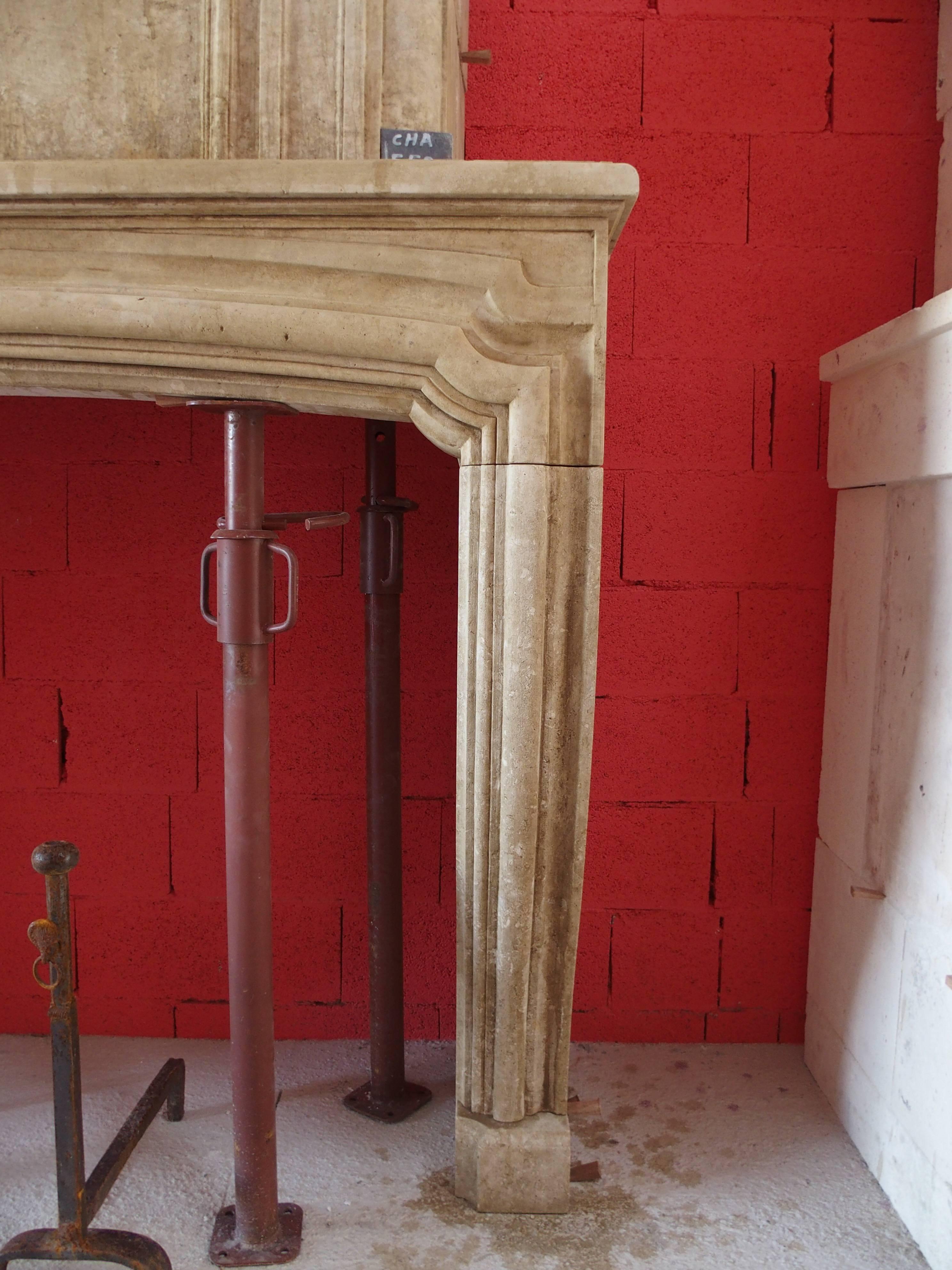 French 18th Century Louis XV Fireplace with Trumeau Hand-Carved in Limestone, France For Sale