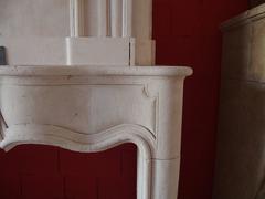 18th Century Elegant Louis XV Wedding-Style Limestone Fireplace with Trumeau