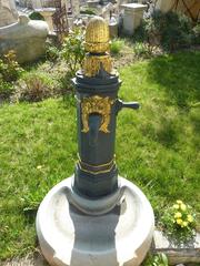 21st Century Central Fountain with Spiraling Basin in Stone and Iron Water Pump