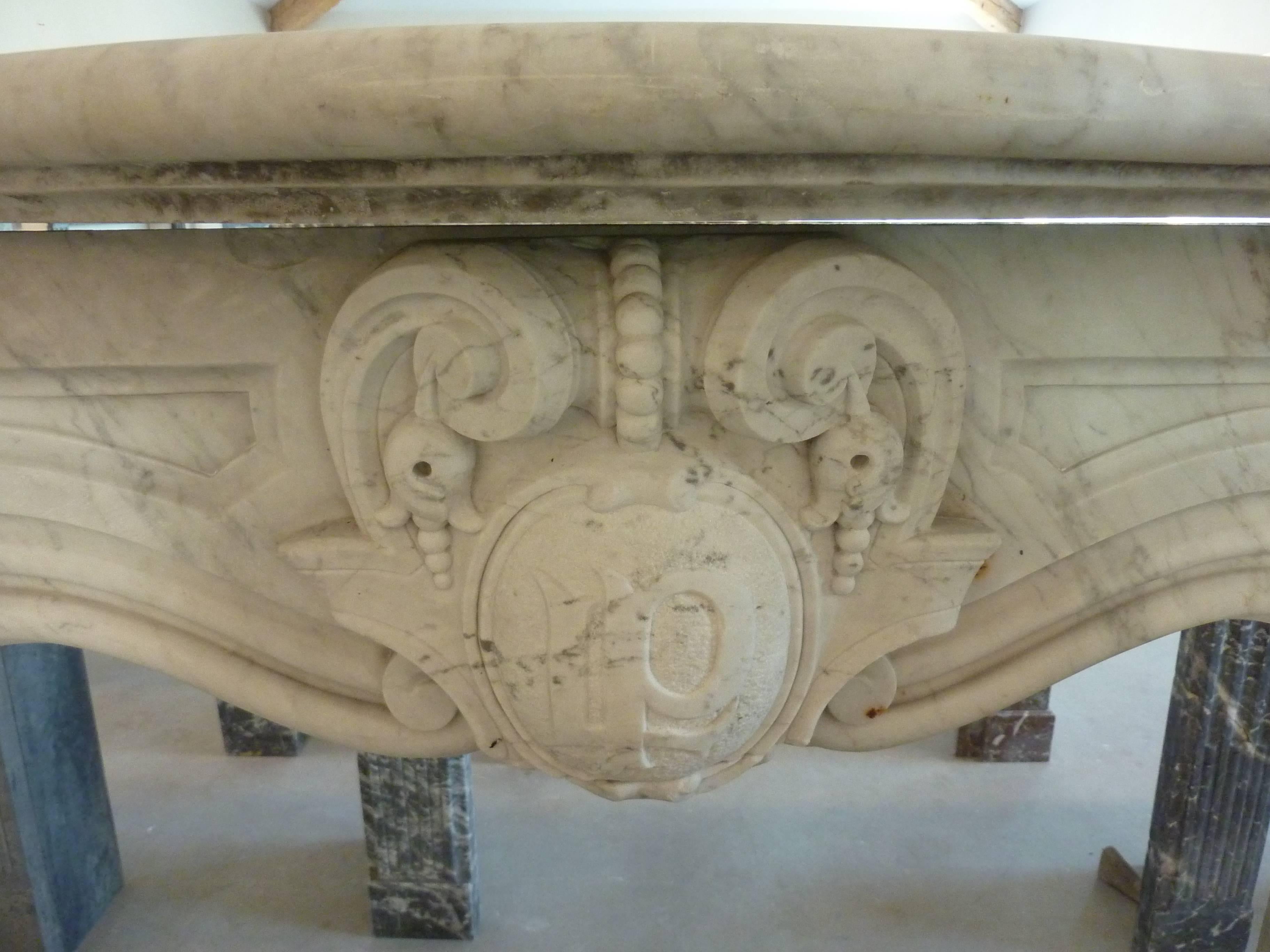 Carved in the 19th century in a nice white marble, this Napoleon III mantel is quite unique and rare.

It presents a magnificent lintel in a crossbow-shape delimited by a molding made of several boudins. It is adorned in its centre by a beautiful