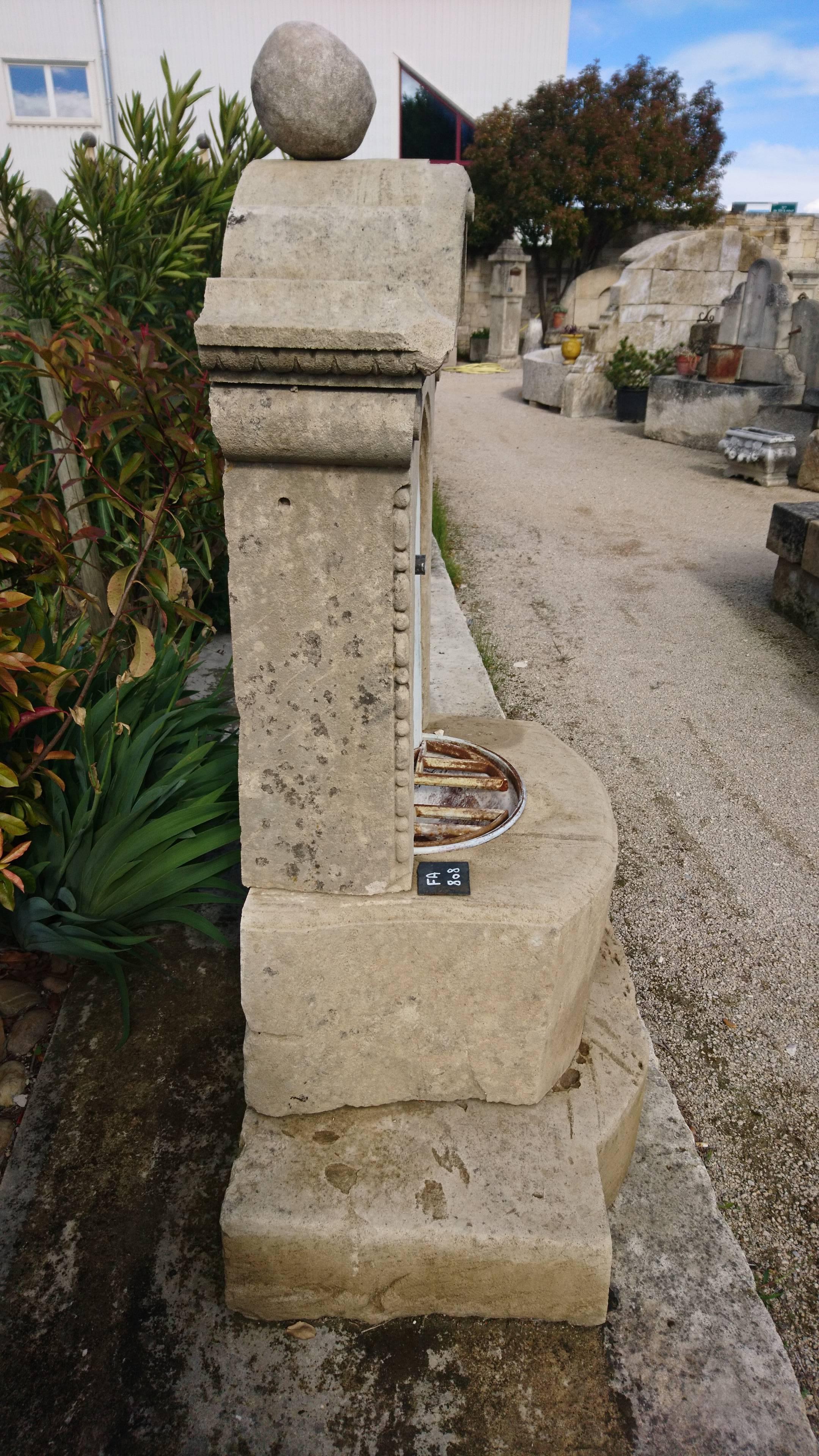 Carved Antique Small Limestone Wall Fountain from Provence, France For Sale