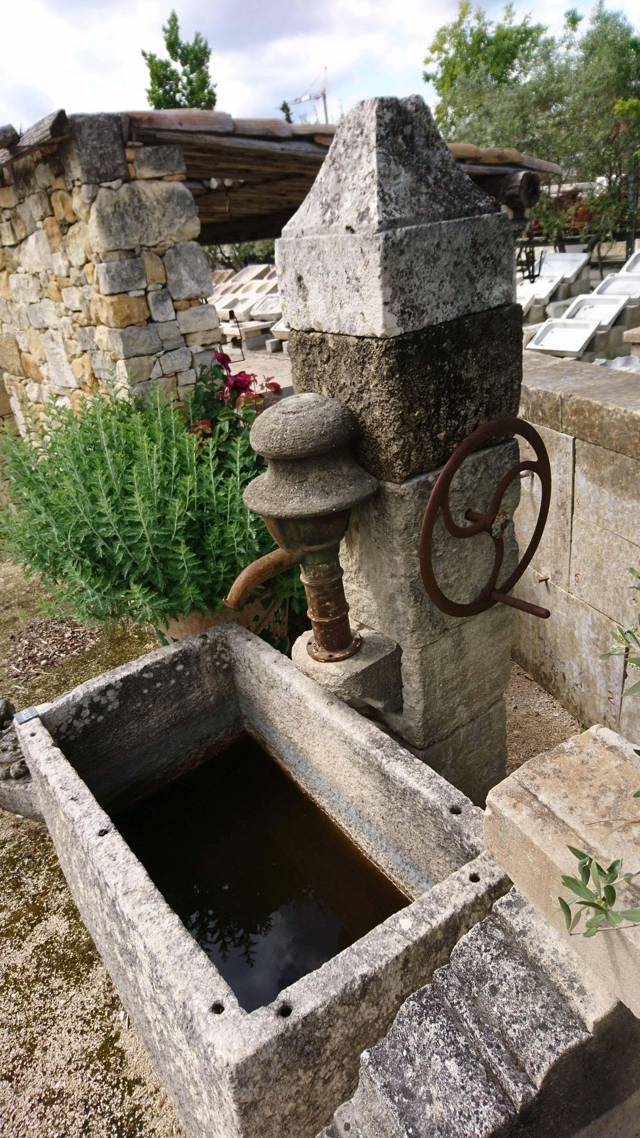 Iron Antique Wall-Fountain with Ancient Manual Water Pump and Monolith Stone Basin For Sale